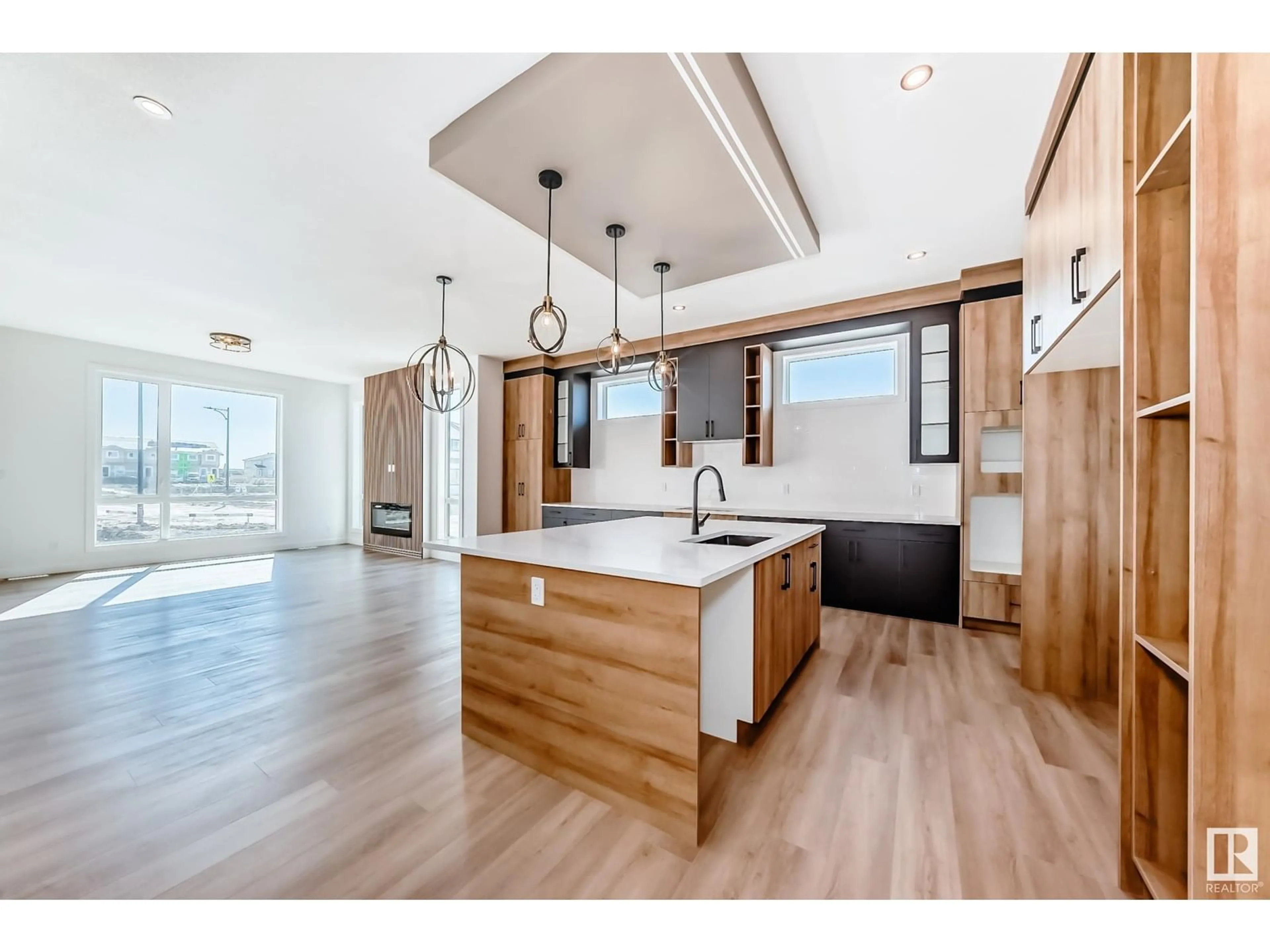 Open concept kitchen, wood/laminate floor for 201 BASIN, Leduc Alberta T9E1M9