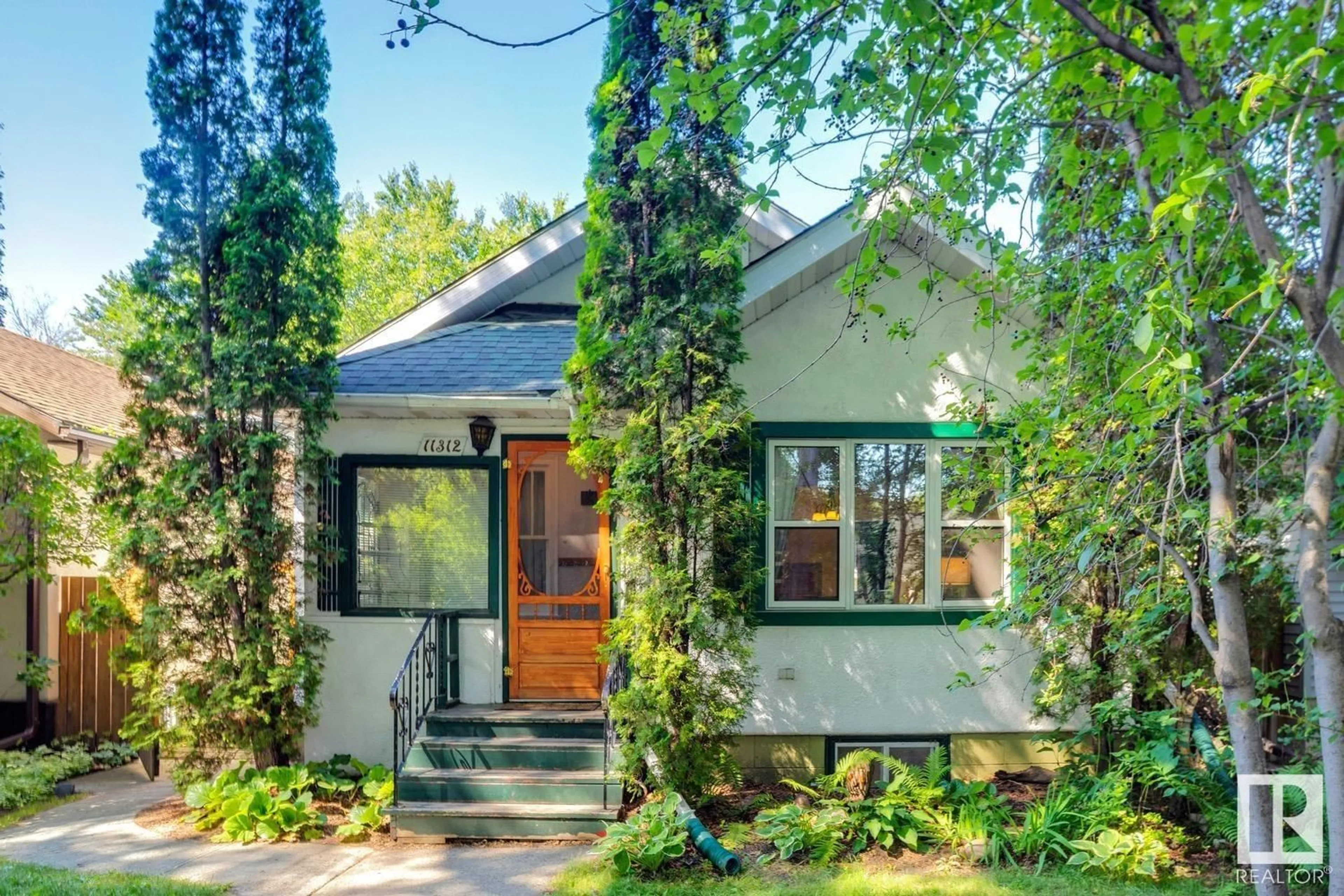 Home with brick exterior material, street for NW - 11312 66 ST, Edmonton Alberta T5B1H6