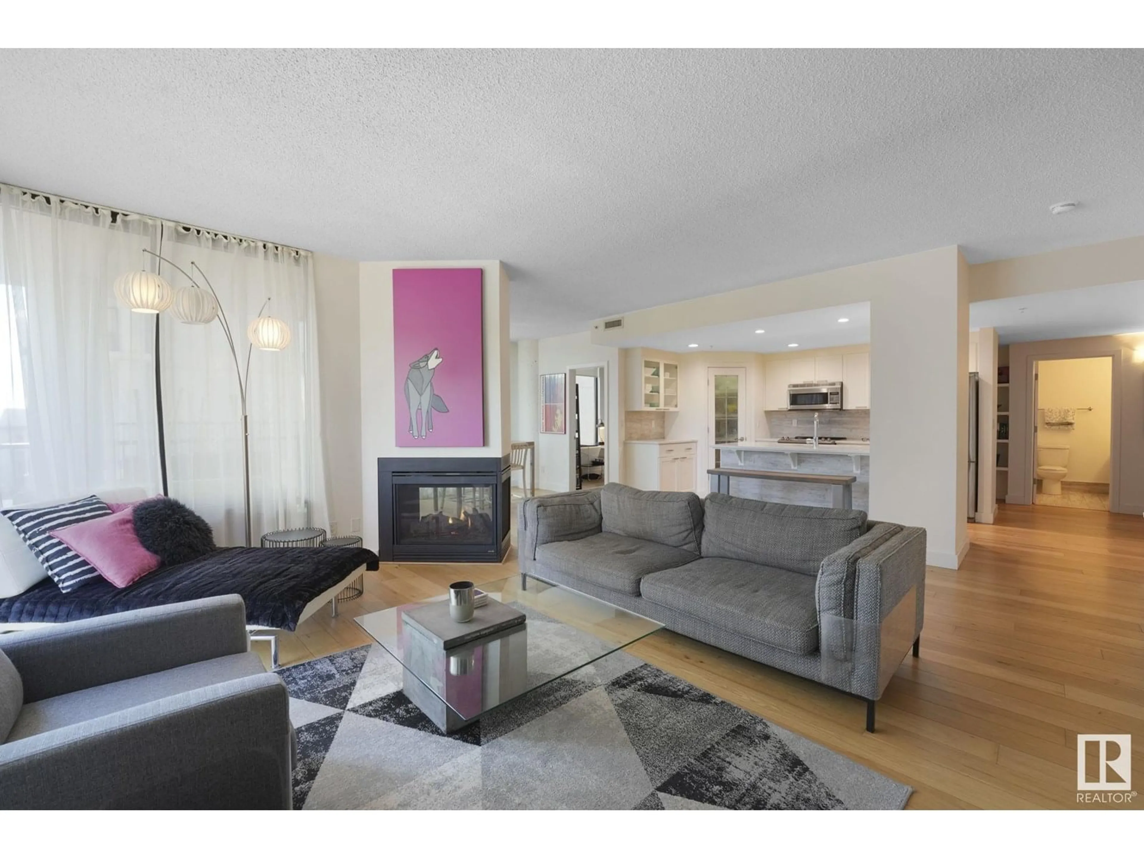 Living room with furniture, wood/laminate floor for 10028 - 601 119 ST, Edmonton Alberta T5K1Y8