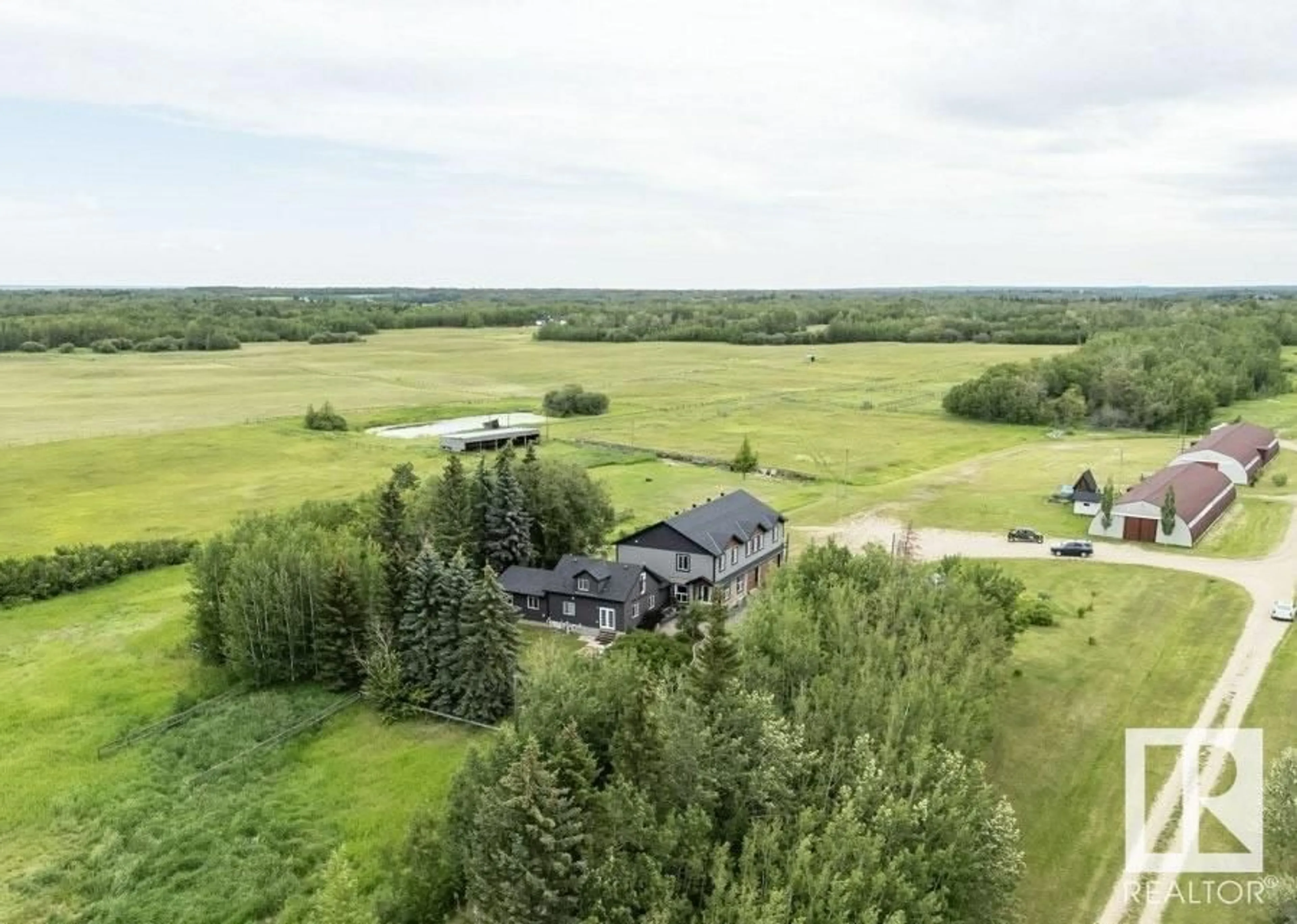 A pic from outside/outdoor area/front of a property/back of a property/a pic from drone, water/lake/river/ocean view for 50415 RGE ROAD 222 A, Rural Leduc County Alberta T0B3M2