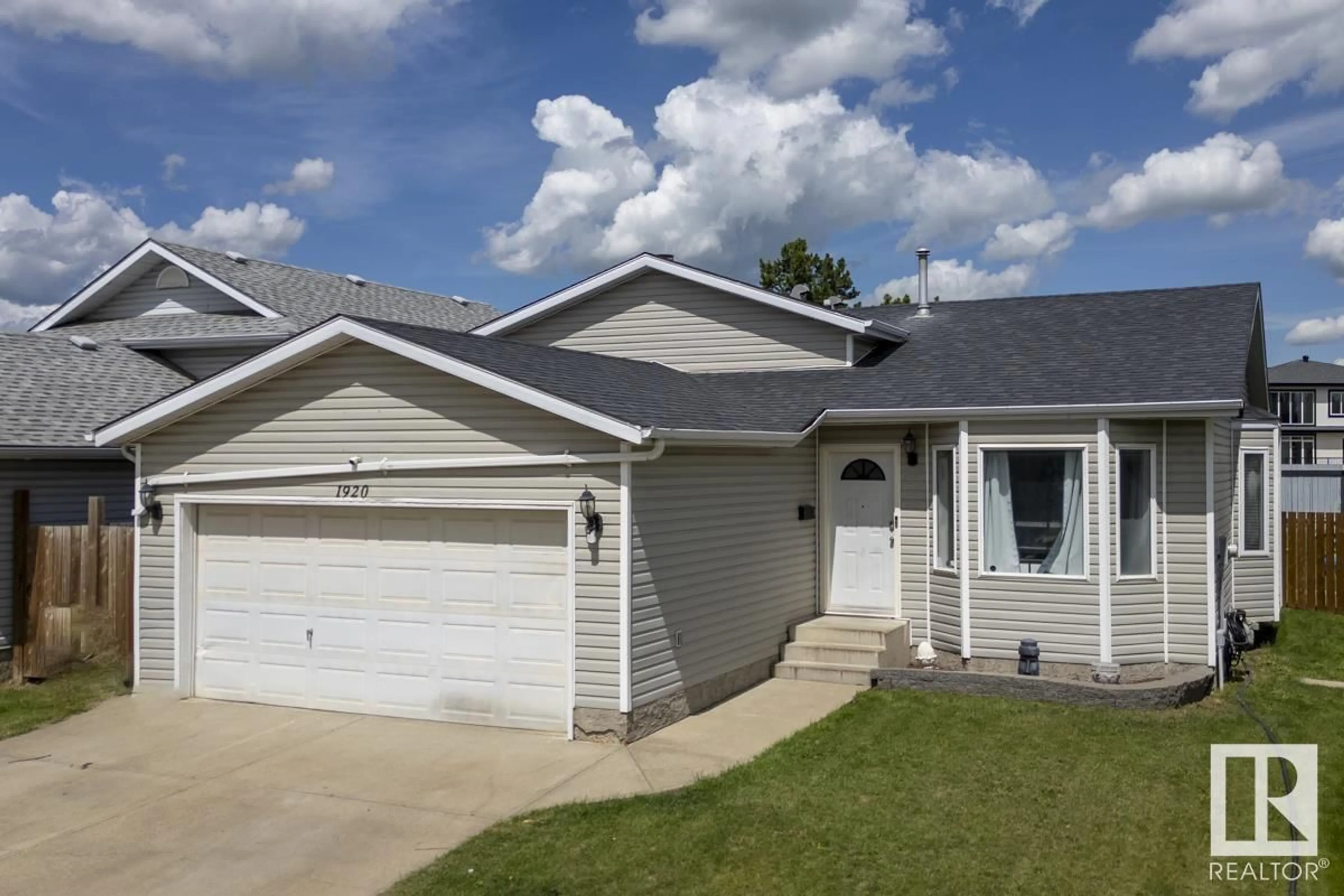 Home with vinyl exterior material, street for 1920 152 AV, Edmonton Alberta T5R2R7