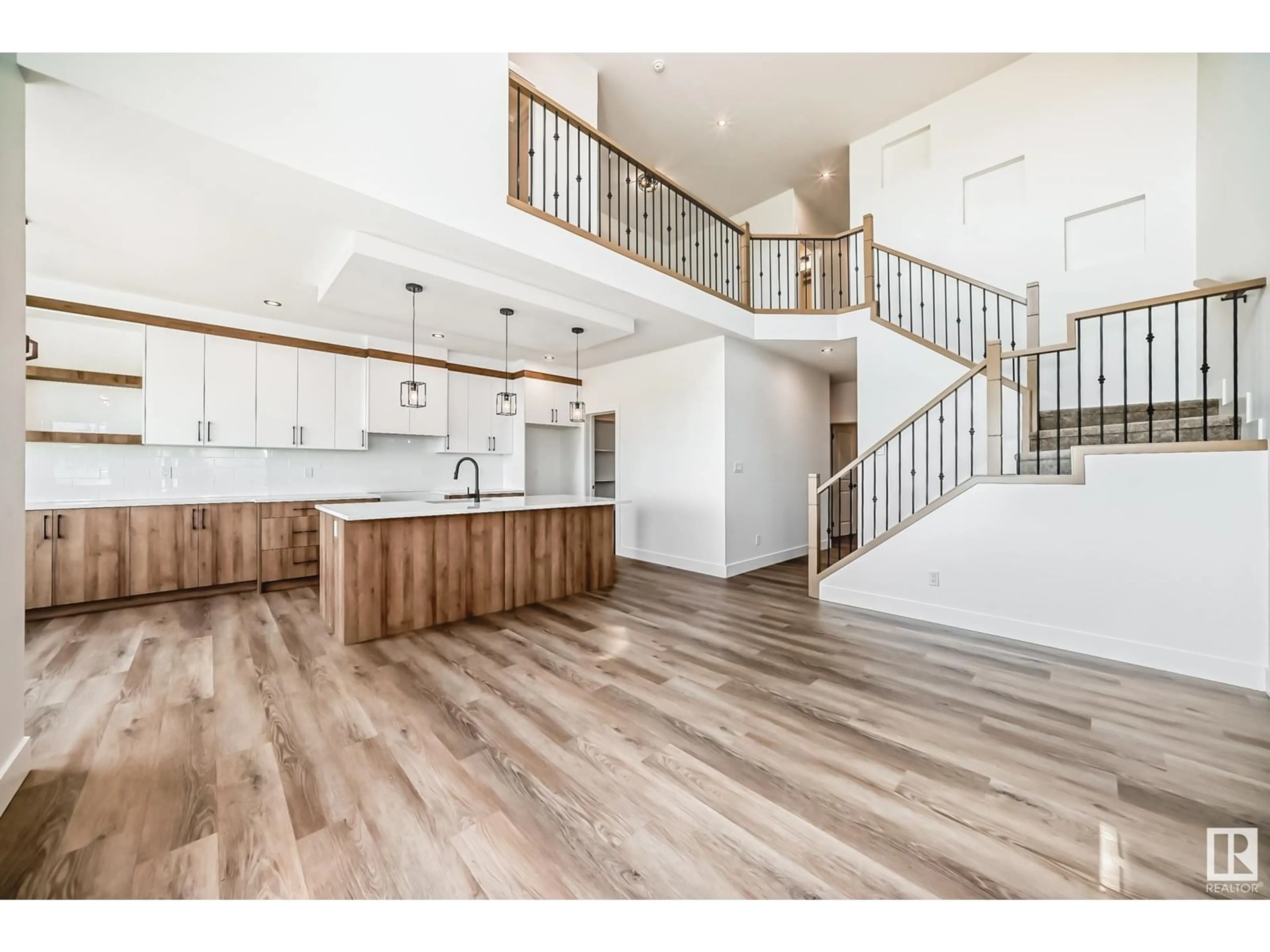 Open concept kitchen, wood/laminate floor for 325 BLUFF CV, Leduc Alberta T9E1R5