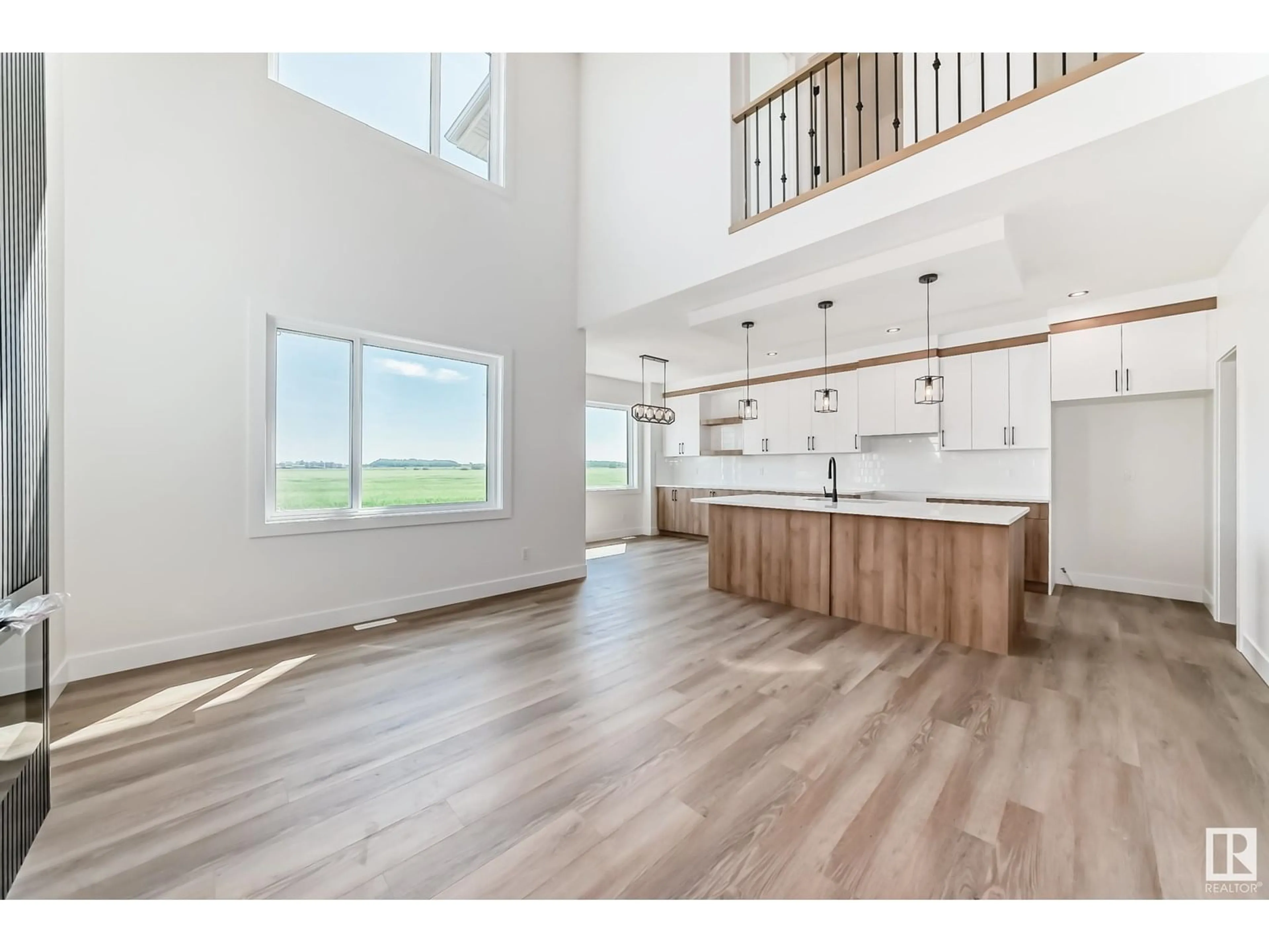 Open concept kitchen, wood/laminate floor for 325 BLUFF CV, Leduc Alberta T9E1R5