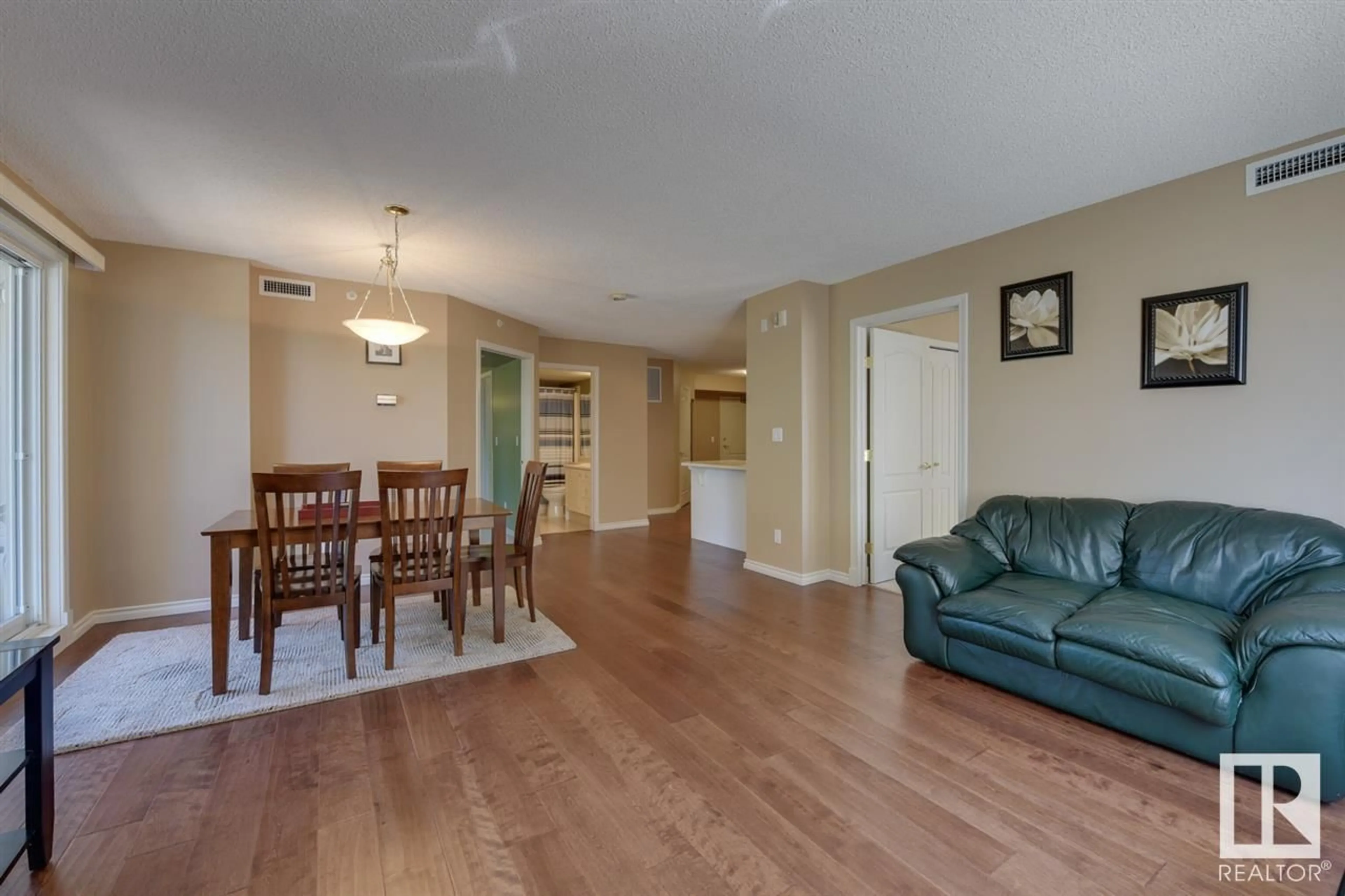 Living room with furniture, wood/laminate floor for #202 - 10649 SASKATCHEWAN DR, Edmonton Alberta T6E6S8
