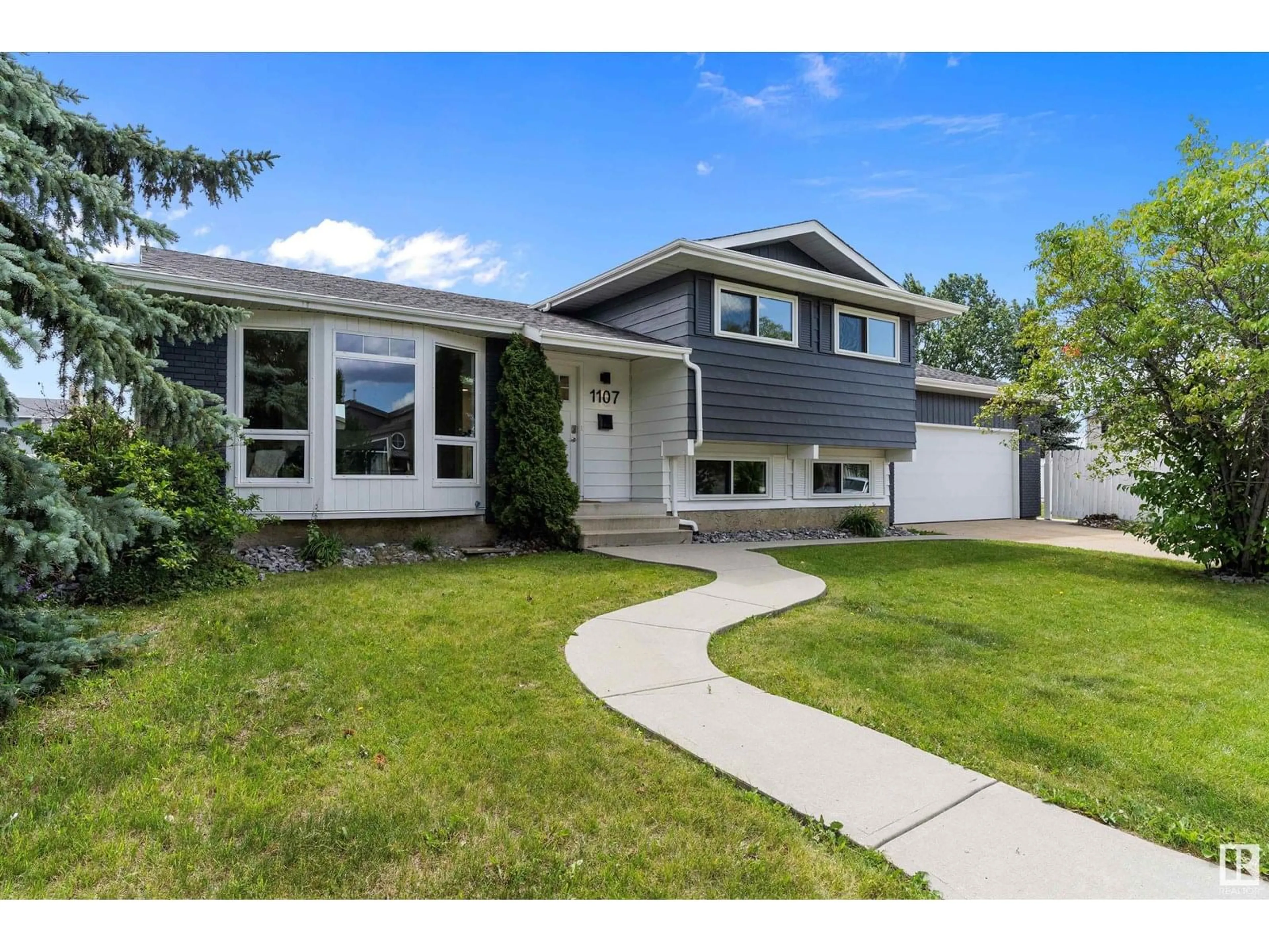 Home with vinyl exterior material, street for 1107 36 ST, Edmonton Alberta T6L2L6