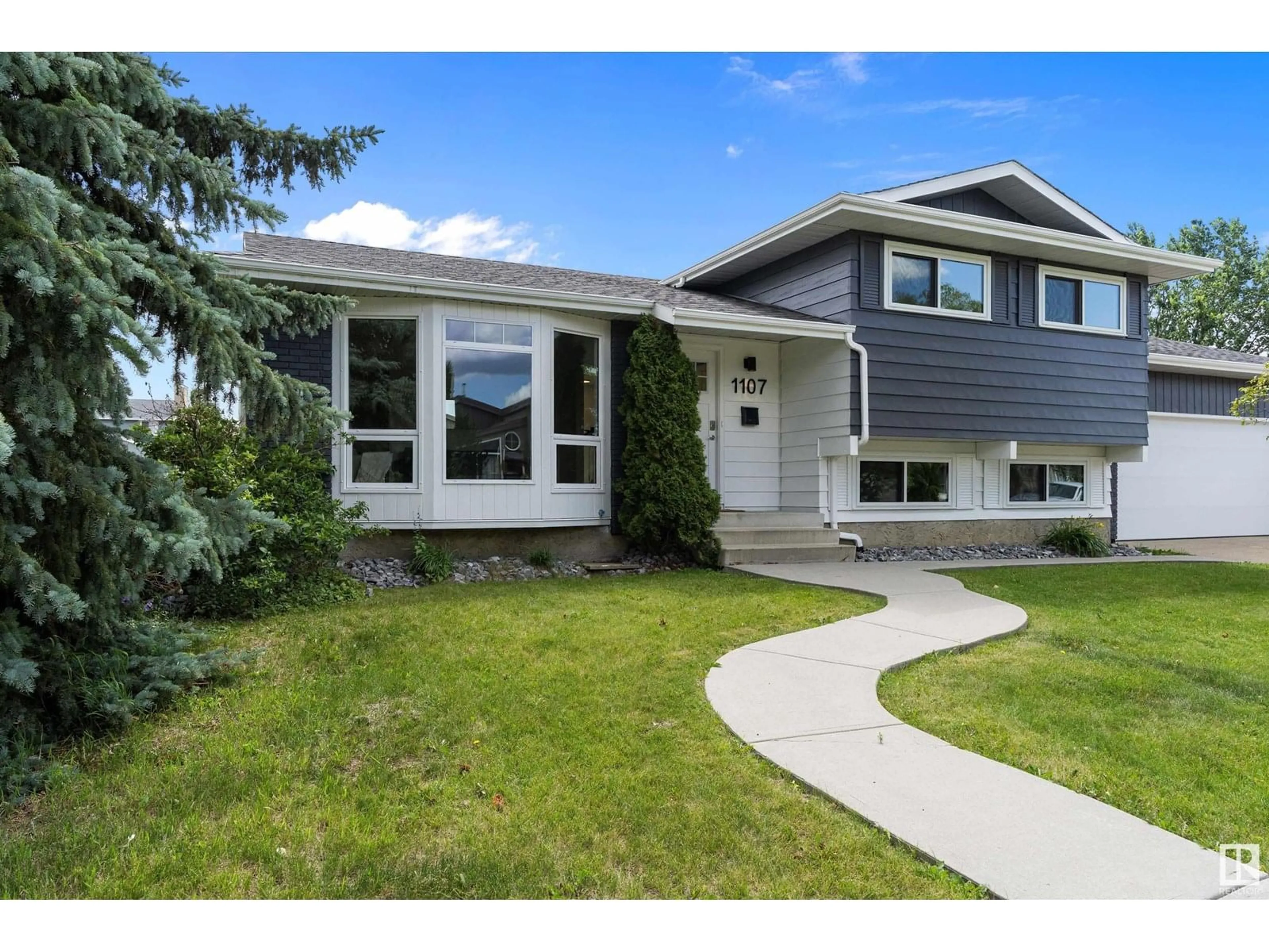 Home with vinyl exterior material, street for 1107 36 ST, Edmonton Alberta T6L2L6
