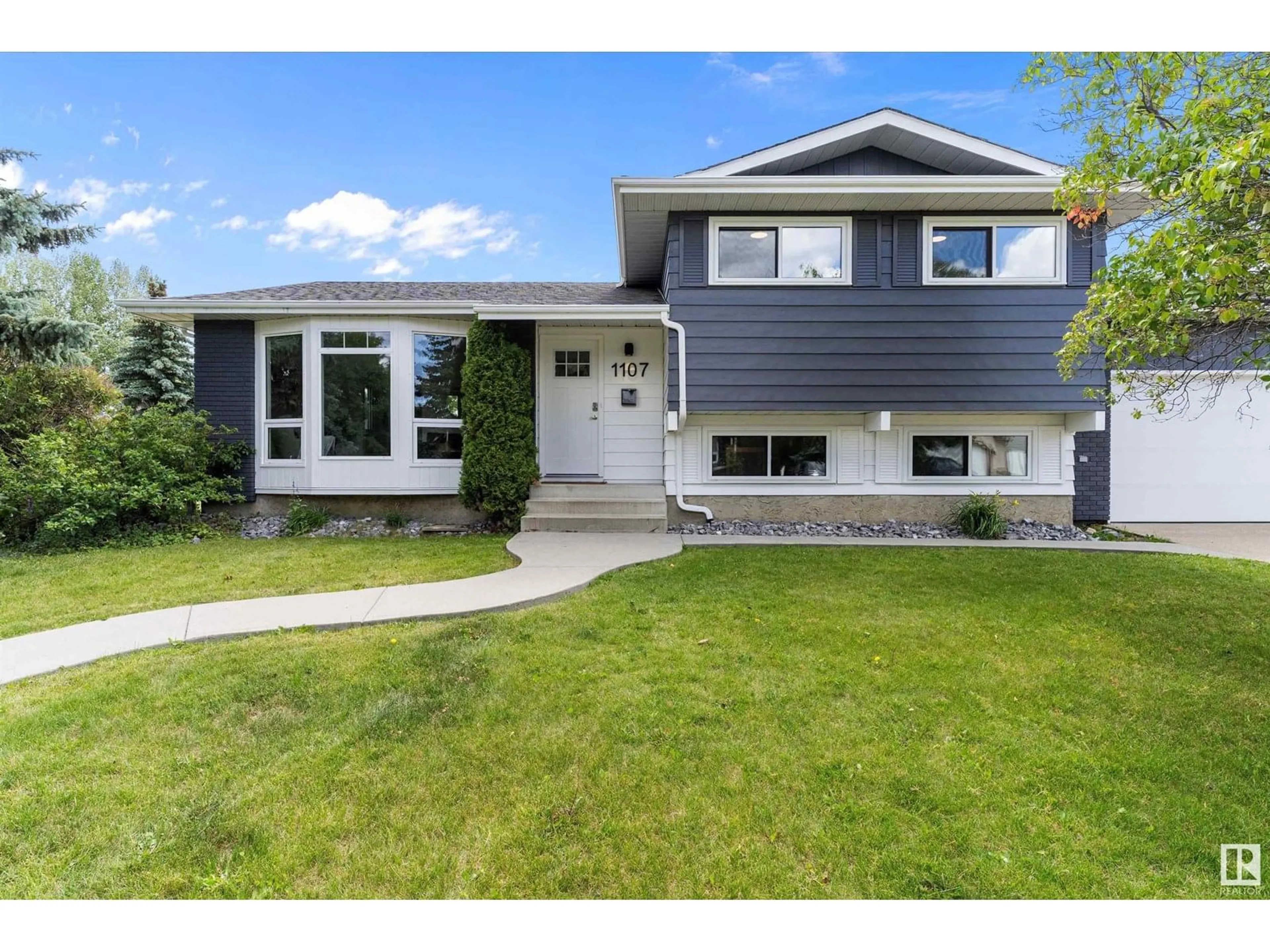 Home with vinyl exterior material, street for 1107 36 ST, Edmonton Alberta T6L2L6