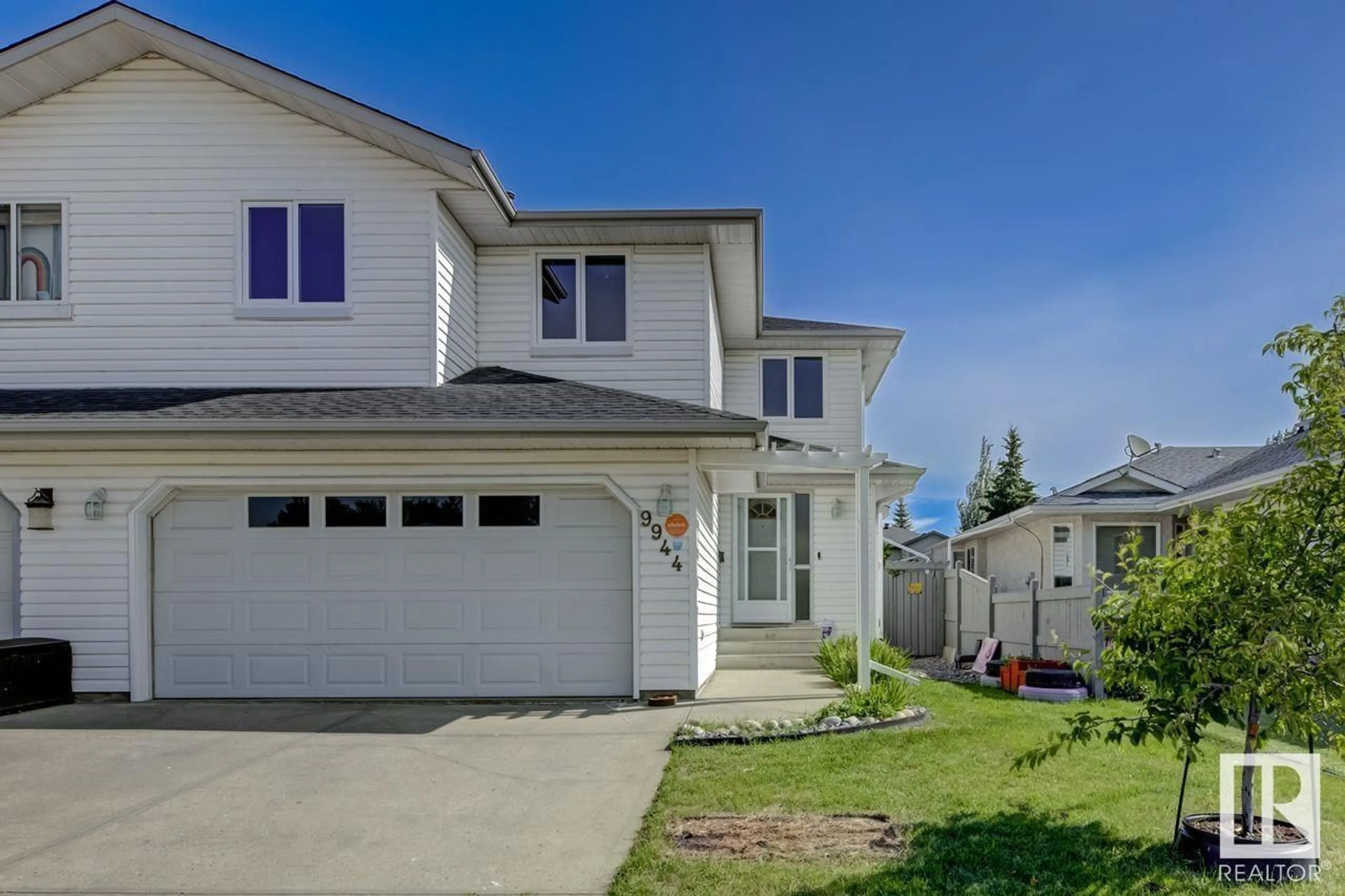 Home with vinyl exterior material, street for NW - 9944 178 AV, Edmonton Alberta T5X5X2