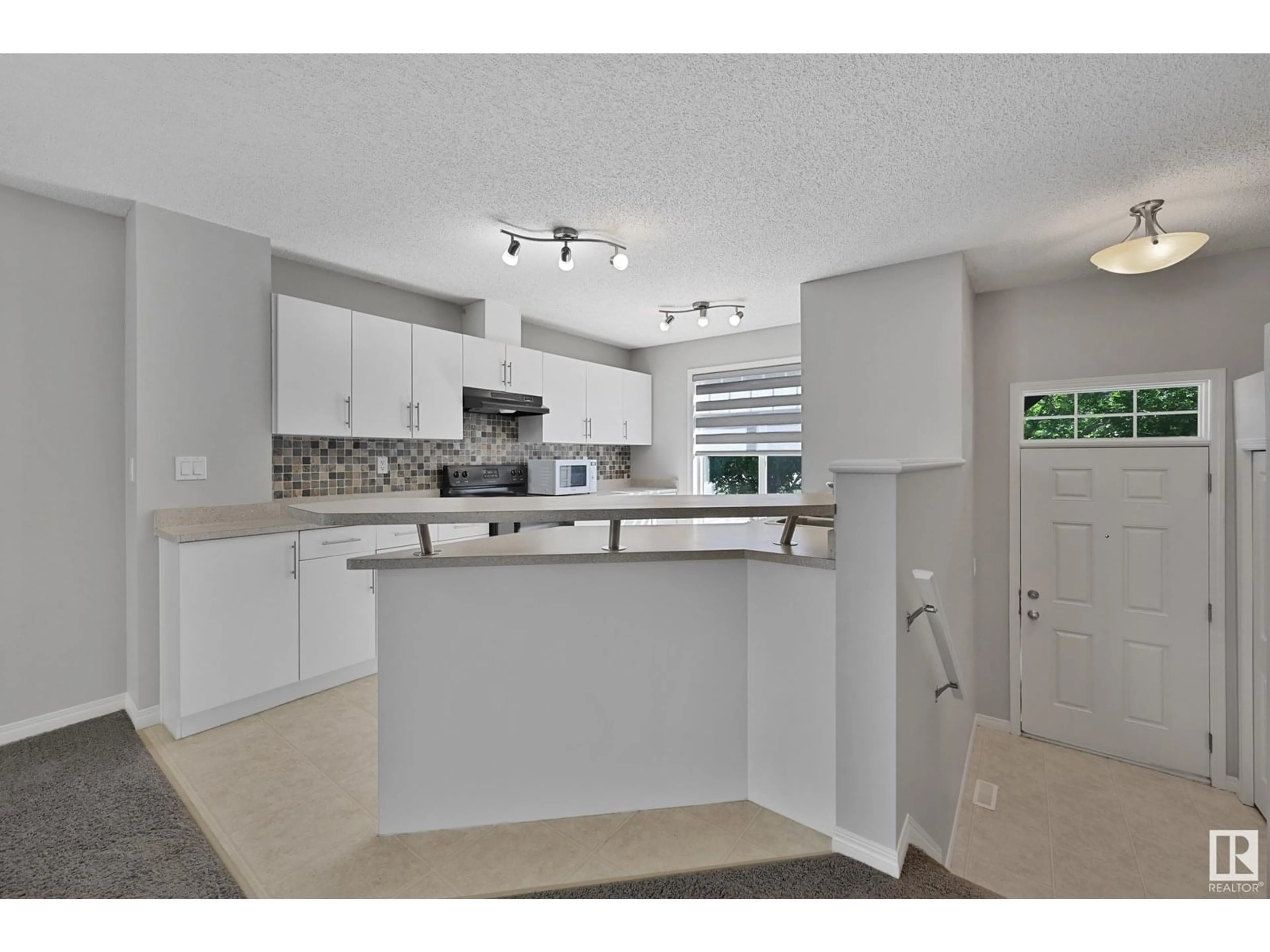 Open concept kitchen, ceramic/tile floor for 465 - 133 HEMINGWAY RD, Edmonton Alberta T6M0J7