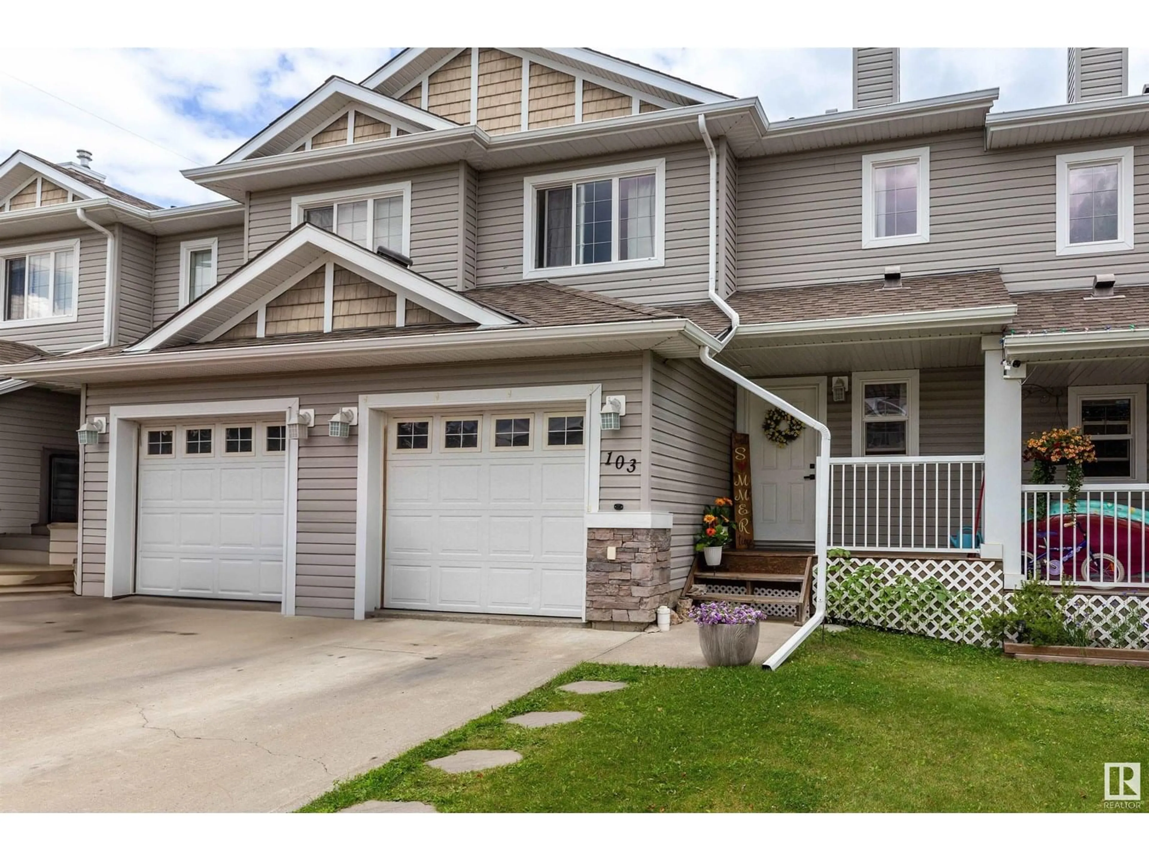 Home with vinyl exterior material, street for 103 GRAYWOOD ME, Stony Plain Alberta T7Z0C2