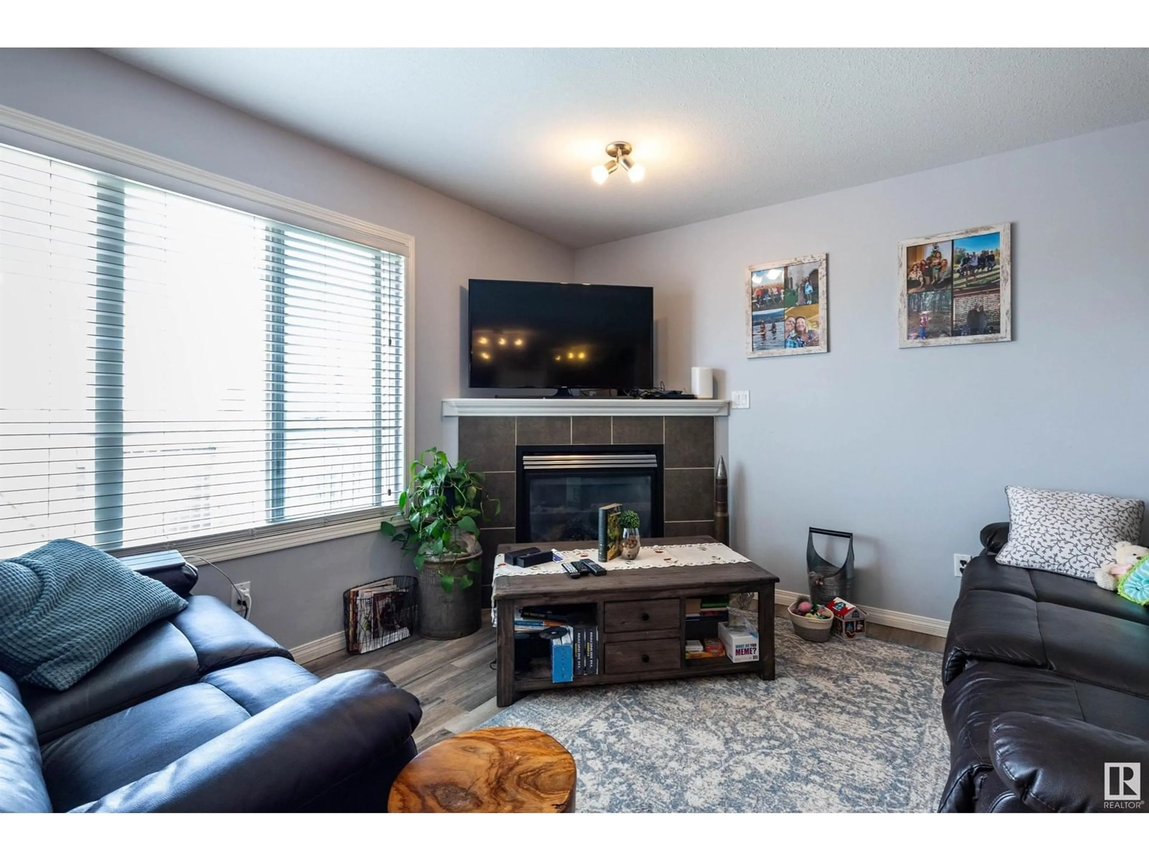 Living room with furniture, wood/laminate floor for 103 GRAYWOOD ME, Stony Plain Alberta T7Z0C2