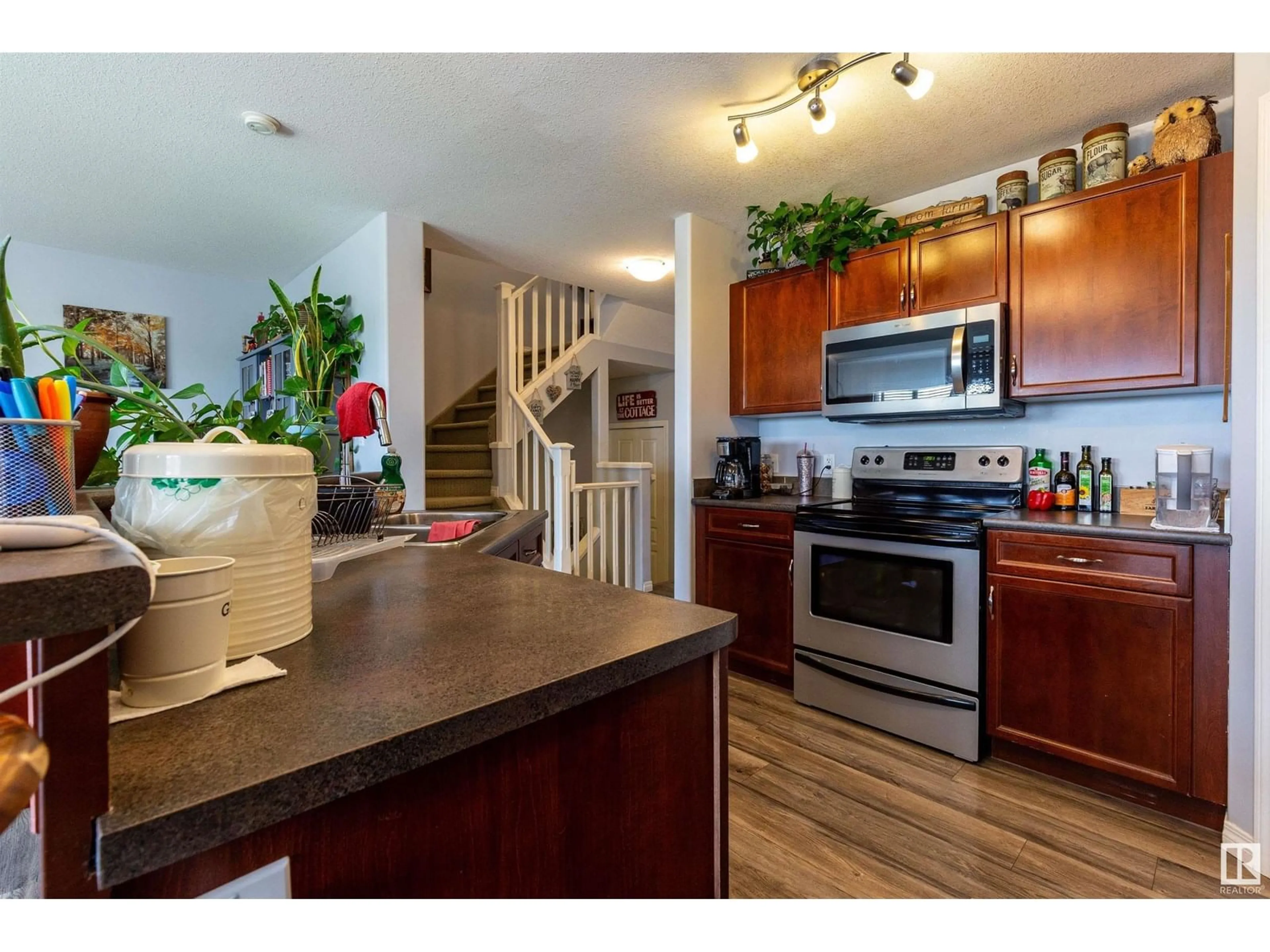 Open concept kitchen, wood/laminate floor for 103 GRAYWOOD ME, Stony Plain Alberta T7Z0C2