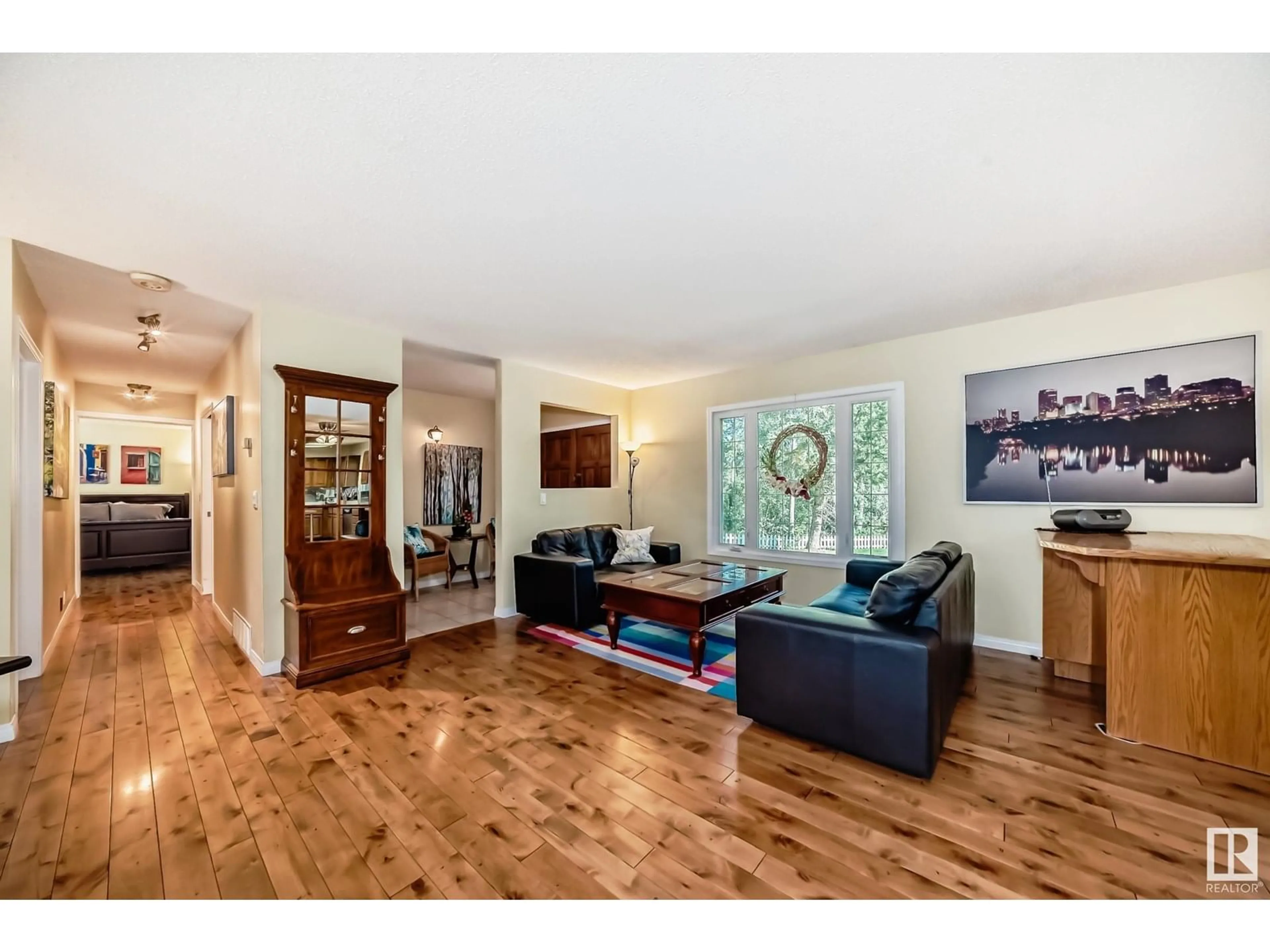 Living room with furniture, wood/laminate floor for 97 52131 RGE ROAD 210, Rural Strathcona County Alberta T8A1A2