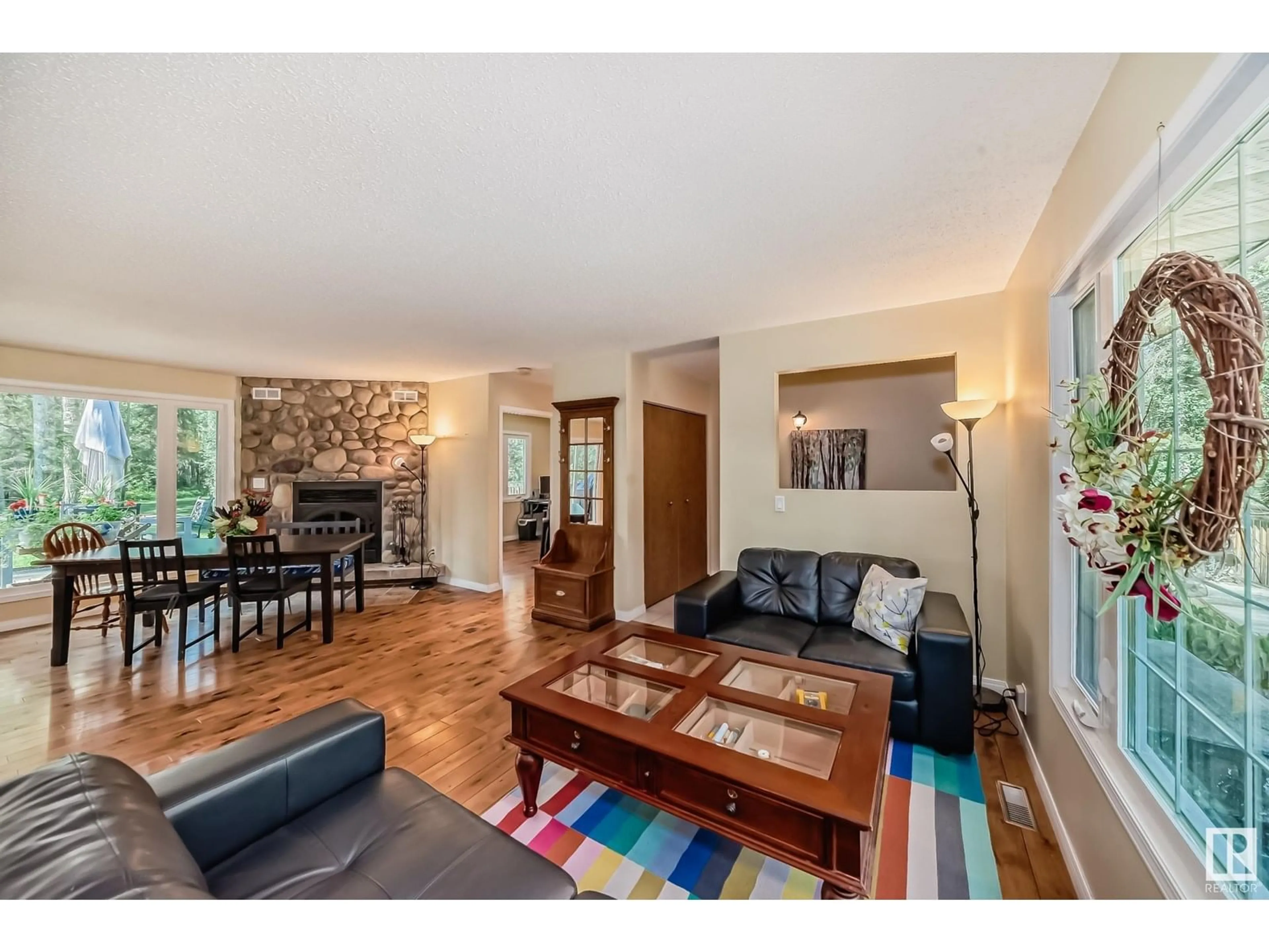 Living room with furniture, wood/laminate floor for 97 52131 RGE ROAD 210, Rural Strathcona County Alberta T8A1A2