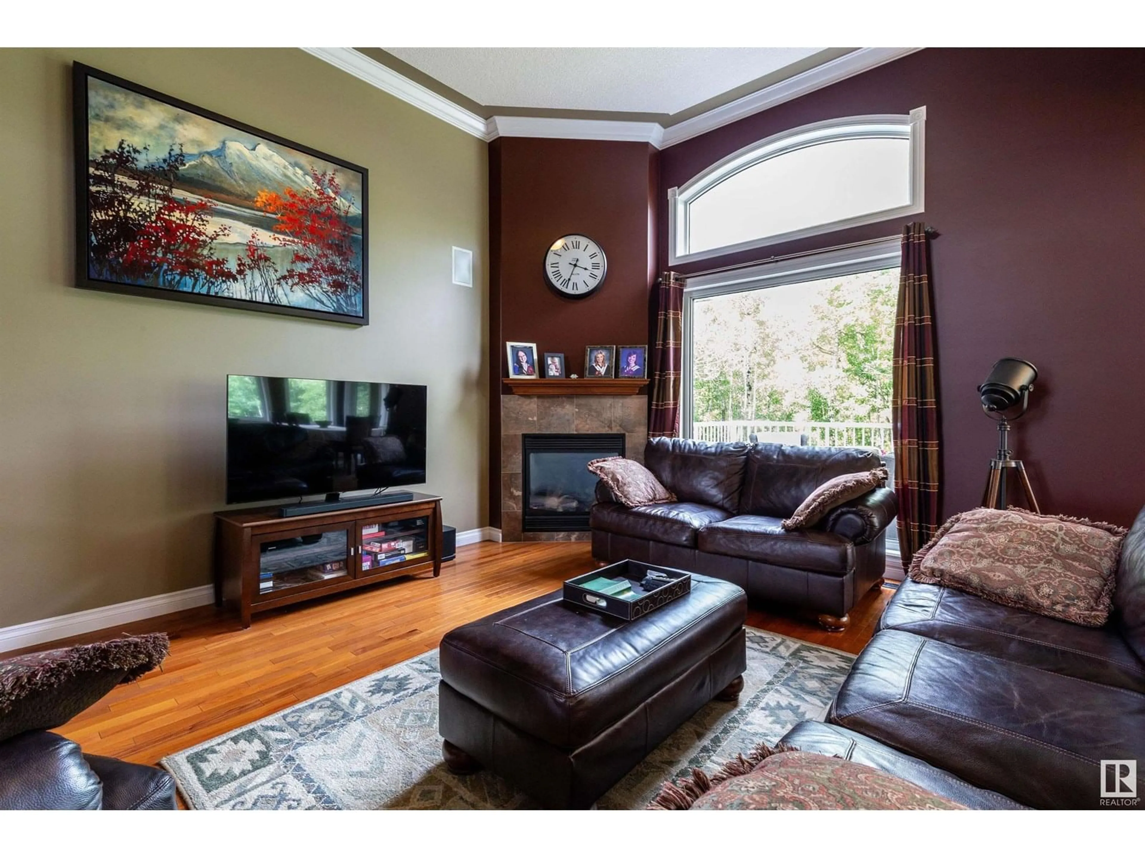Living room with furniture, wood/laminate floor for #194 - 52422 RGE ROAD 224, Rural Strathcona County Alberta T8A6N1