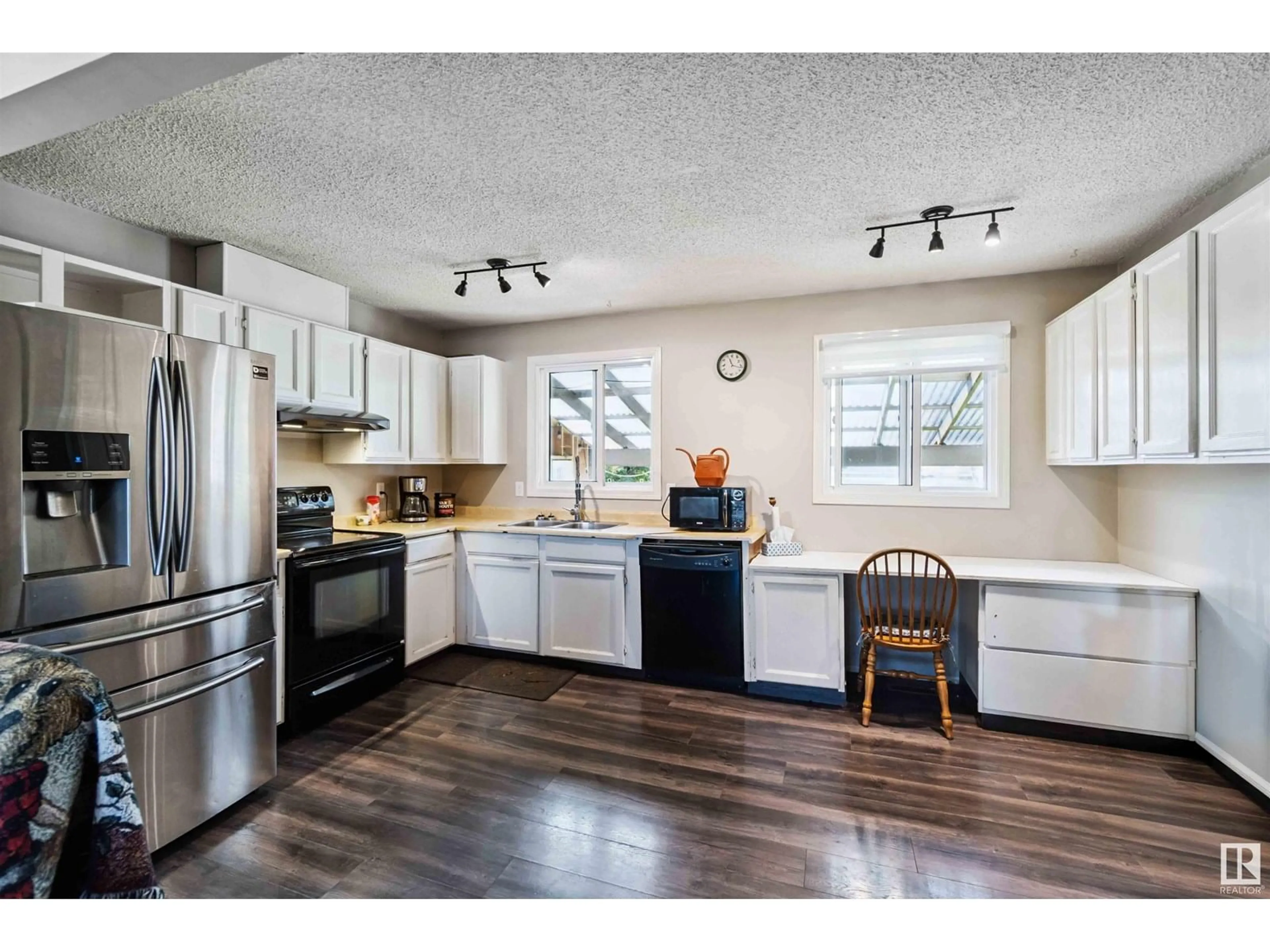 Open concept kitchen, wood/laminate floor for 3913 39 AV, Leduc Alberta T9E4W7