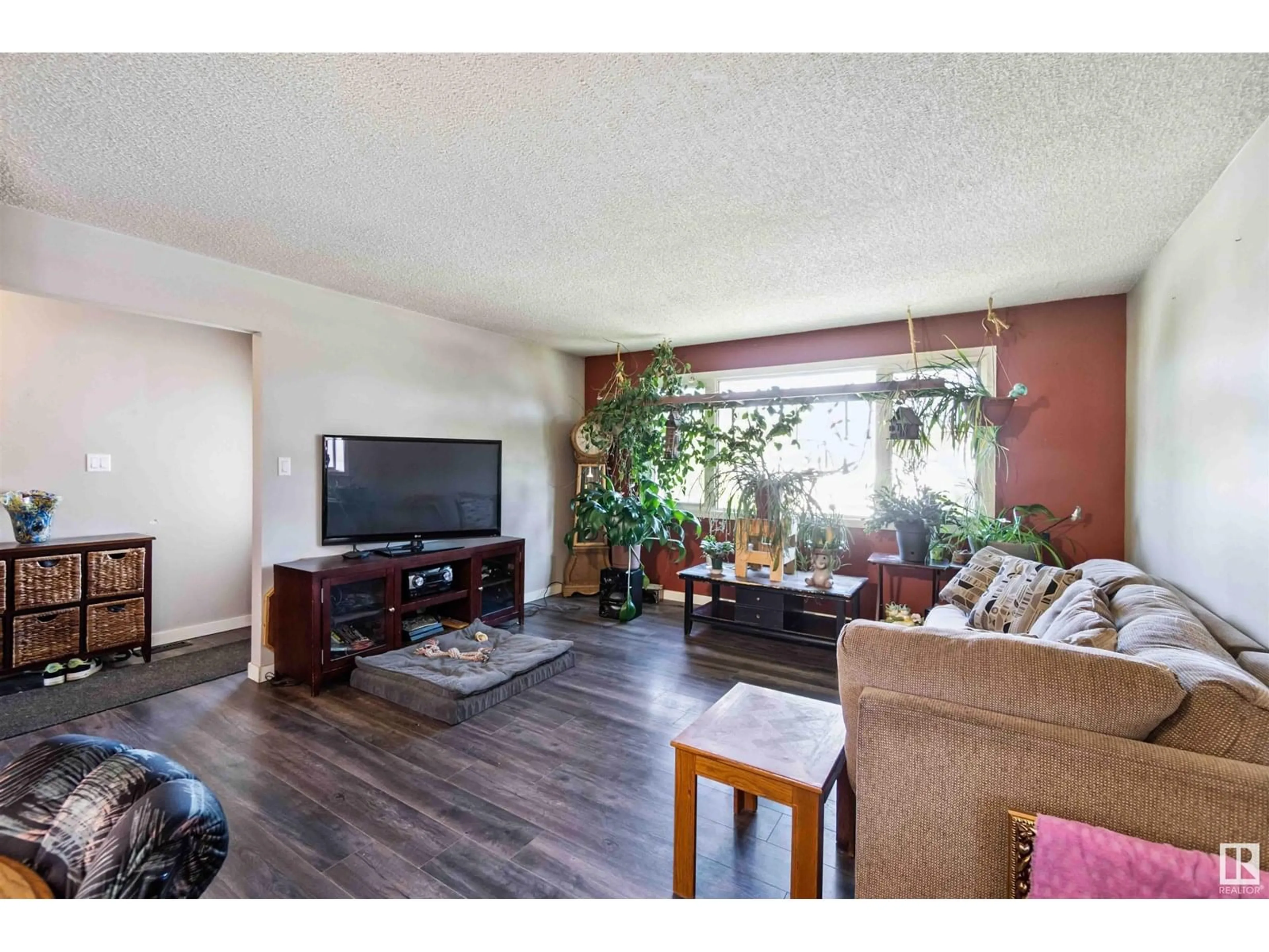 Living room with furniture, wood/laminate floor for 3913 39 AV, Leduc Alberta T9E4W7