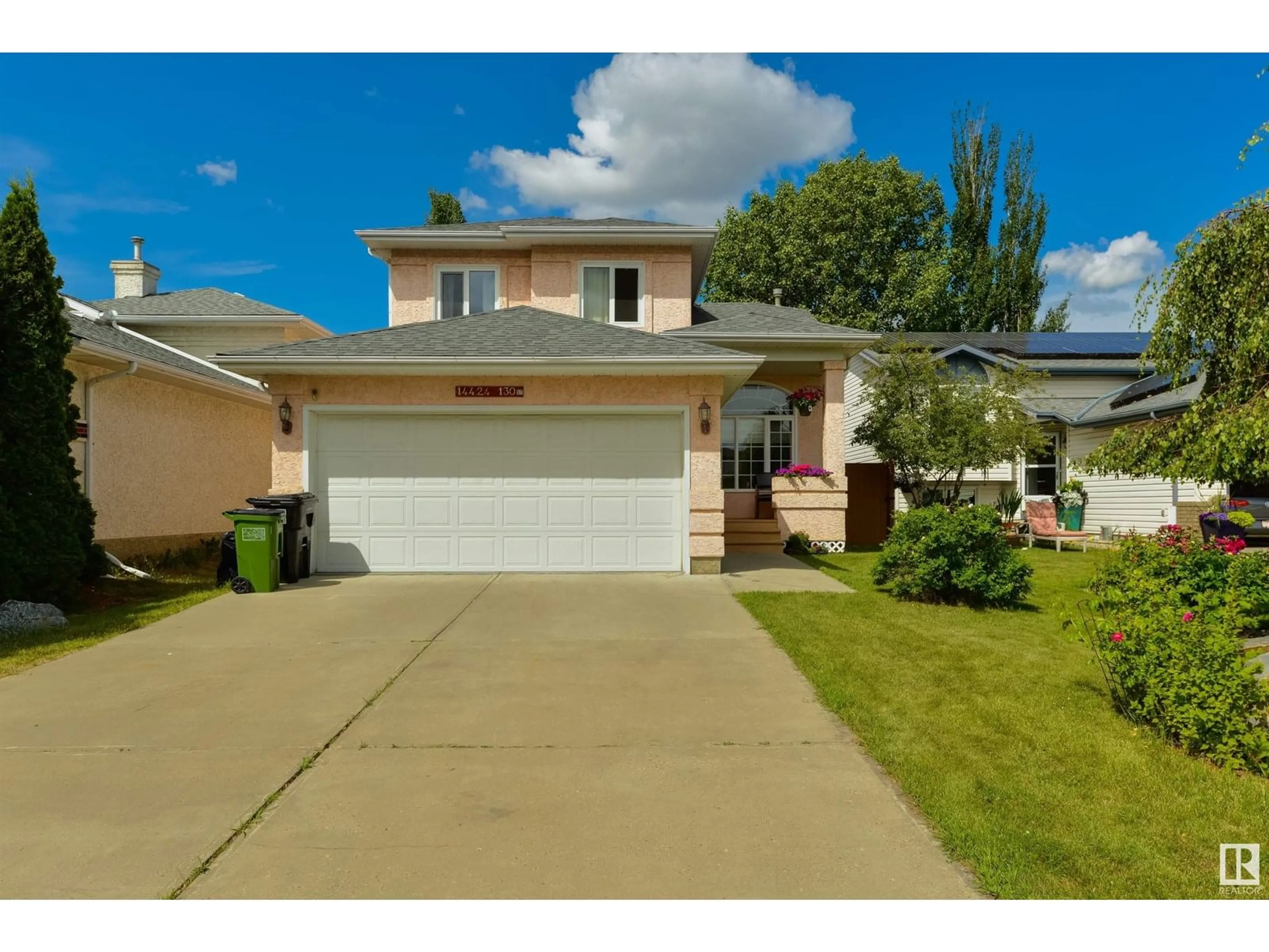 Home with vinyl exterior material, street for 14424 130 ST, Edmonton Alberta T6V1E2