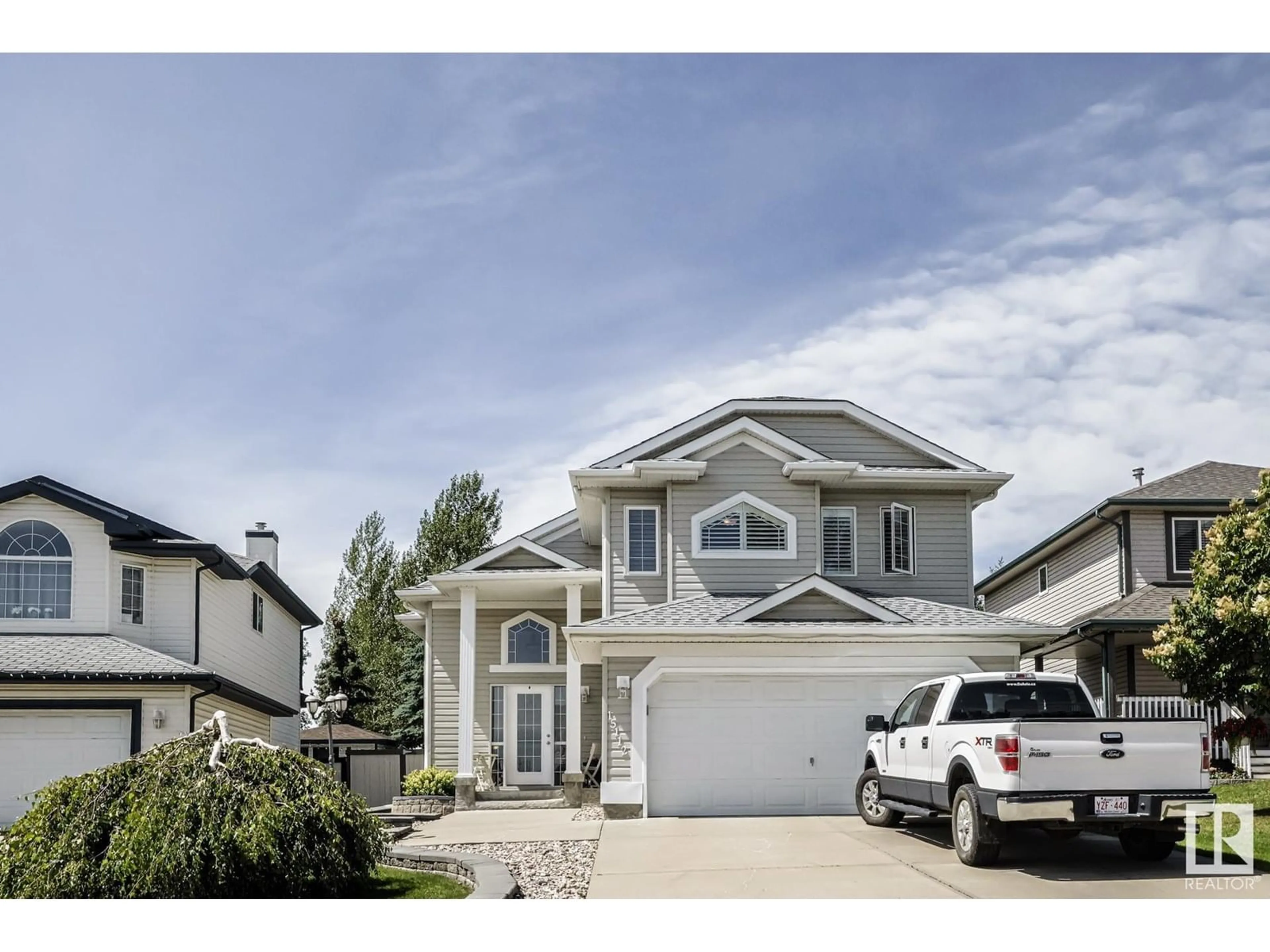 Home with vinyl exterior material, street for NW - 15112 48 ST, Edmonton Alberta T5Y3A2