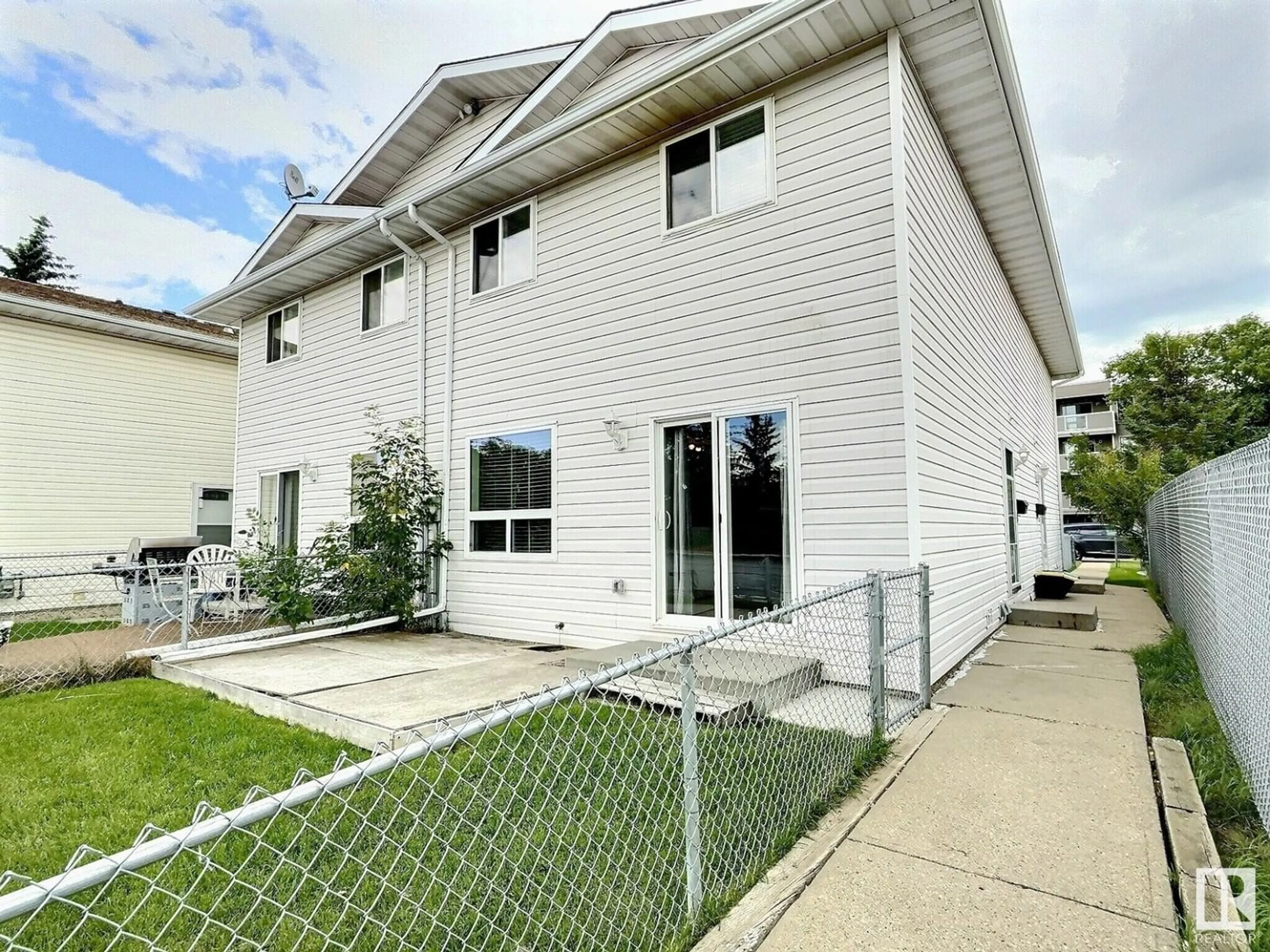 Home with vinyl exterior material, street for 2206 38 ST, Edmonton Alberta T6L4C3