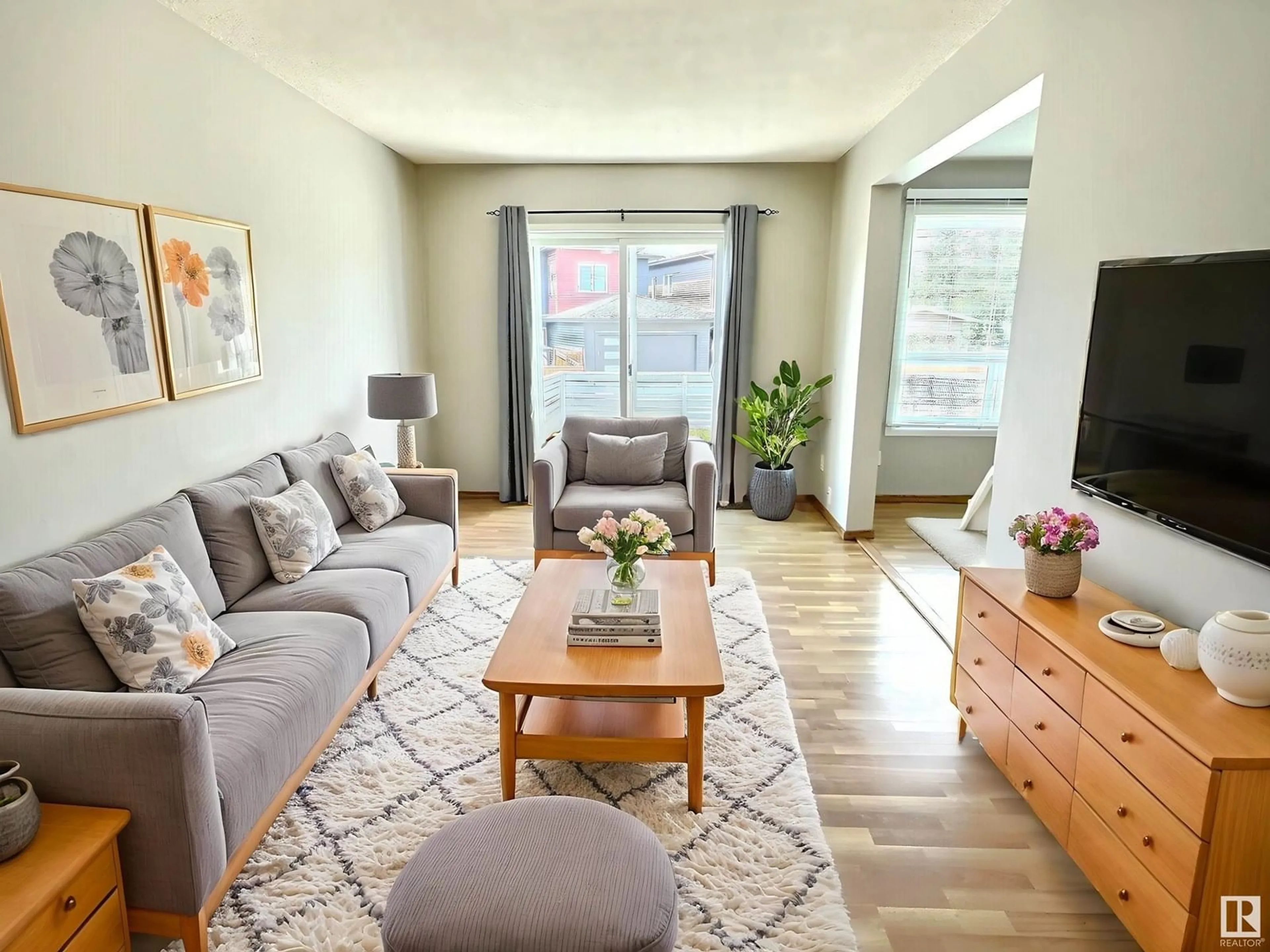 Living room with furniture, wood/laminate floor for 2206 38 ST, Edmonton Alberta T6L4C3