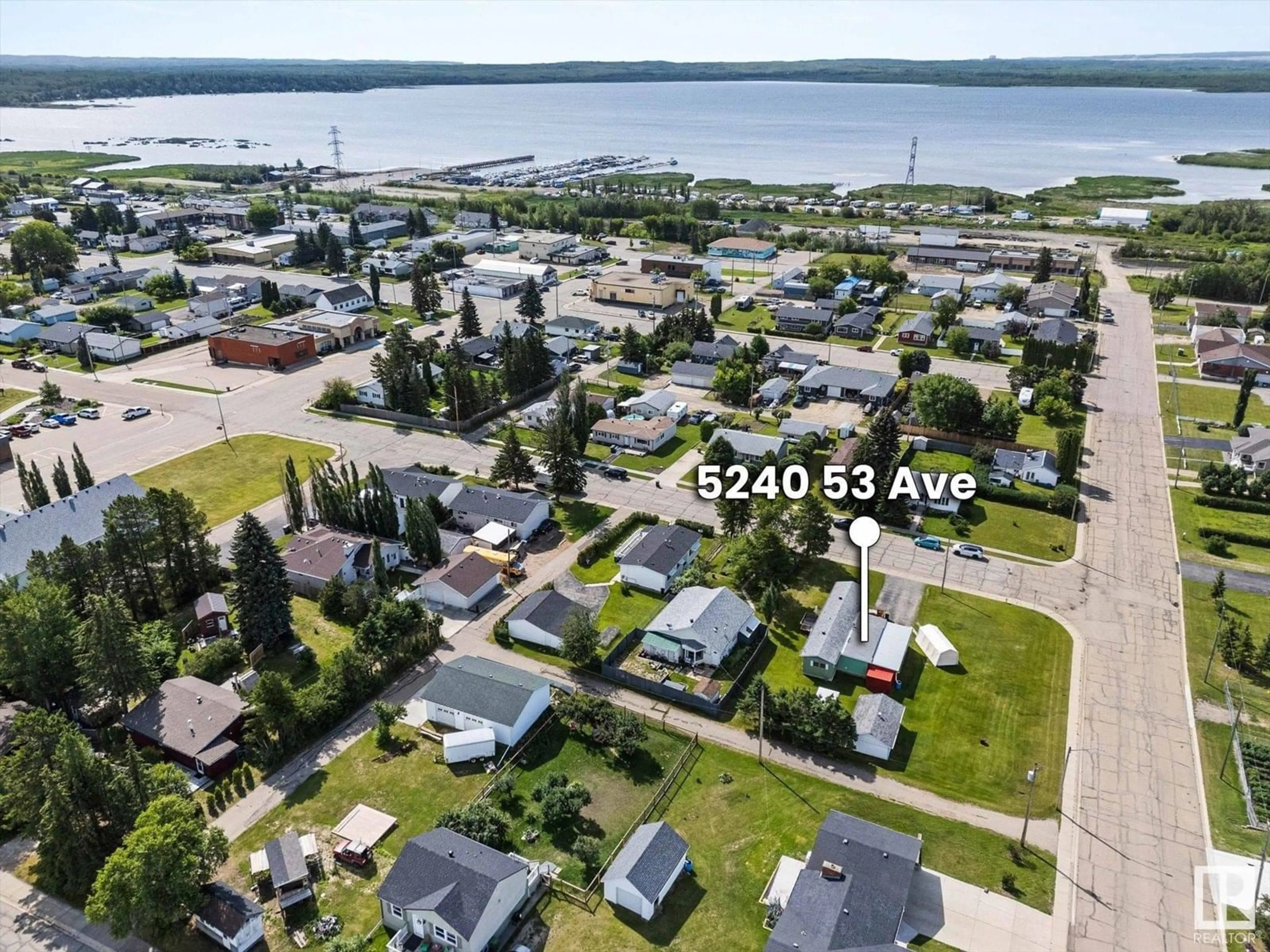A pic from outside/outdoor area/front of a property/back of a property/a pic from drone, water/lake/river/ocean view for 5240 53 AV, Wabamun Alberta T0E2K0