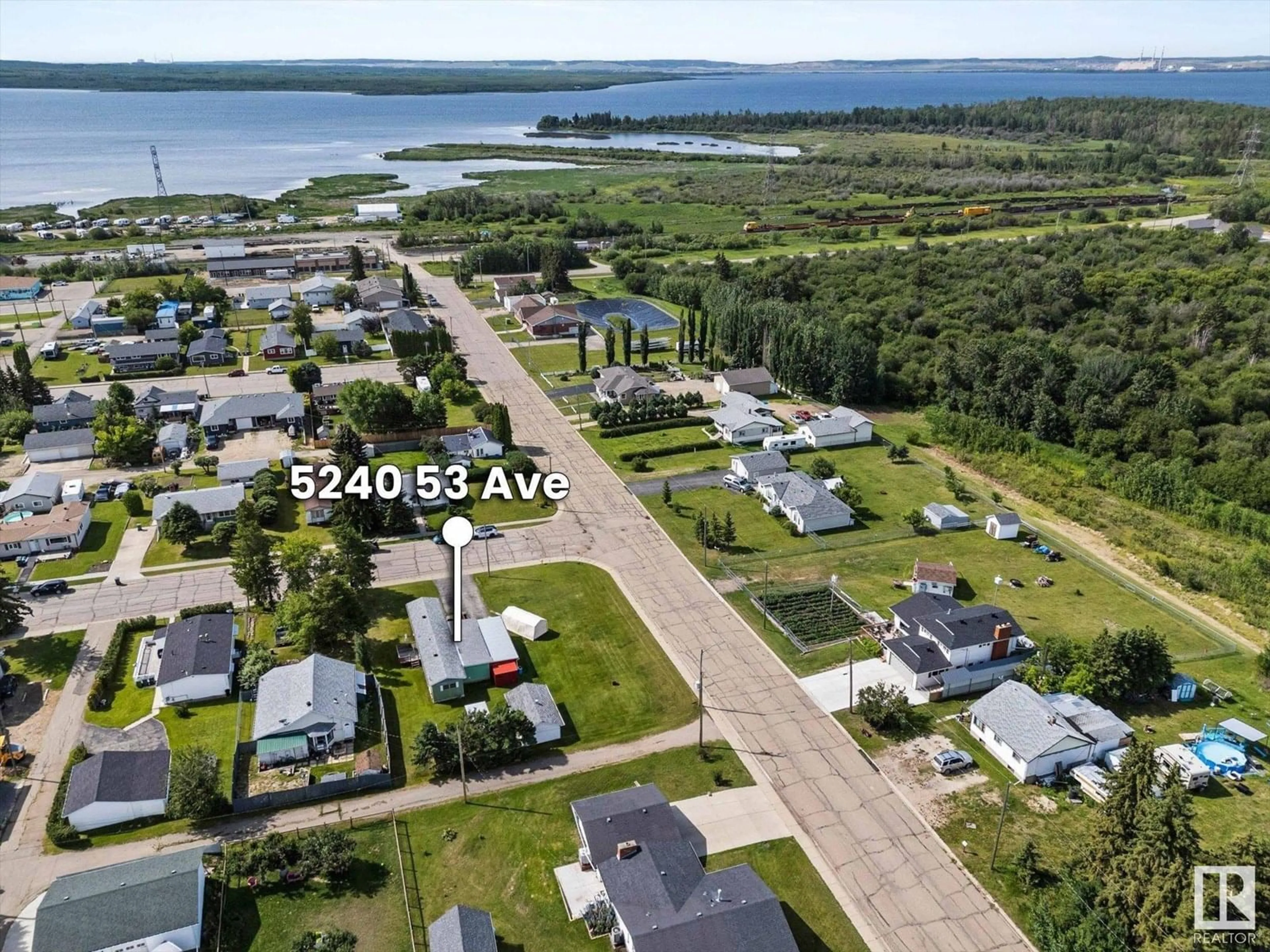 A pic from outside/outdoor area/front of a property/back of a property/a pic from drone, water/lake/river/ocean view for 5240 53 AV, Wabamun Alberta T0E2K0