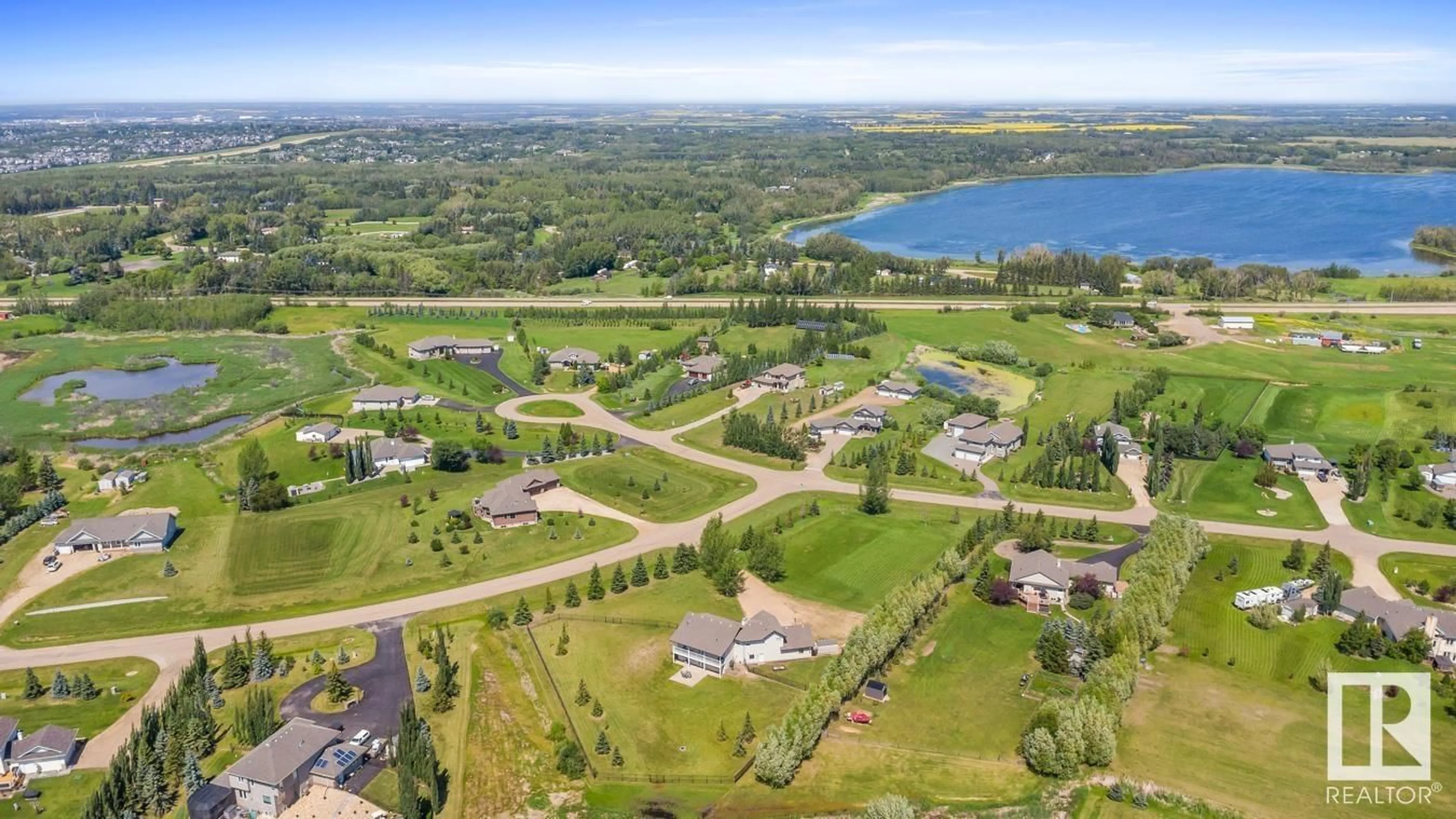 A pic from outside/outdoor area/front of a property/back of a property/a pic from drone, water/lake/river/ocean view for 52358 - 361 RGE ROAD 225, Rural Strathcona County Alberta T8C1N7