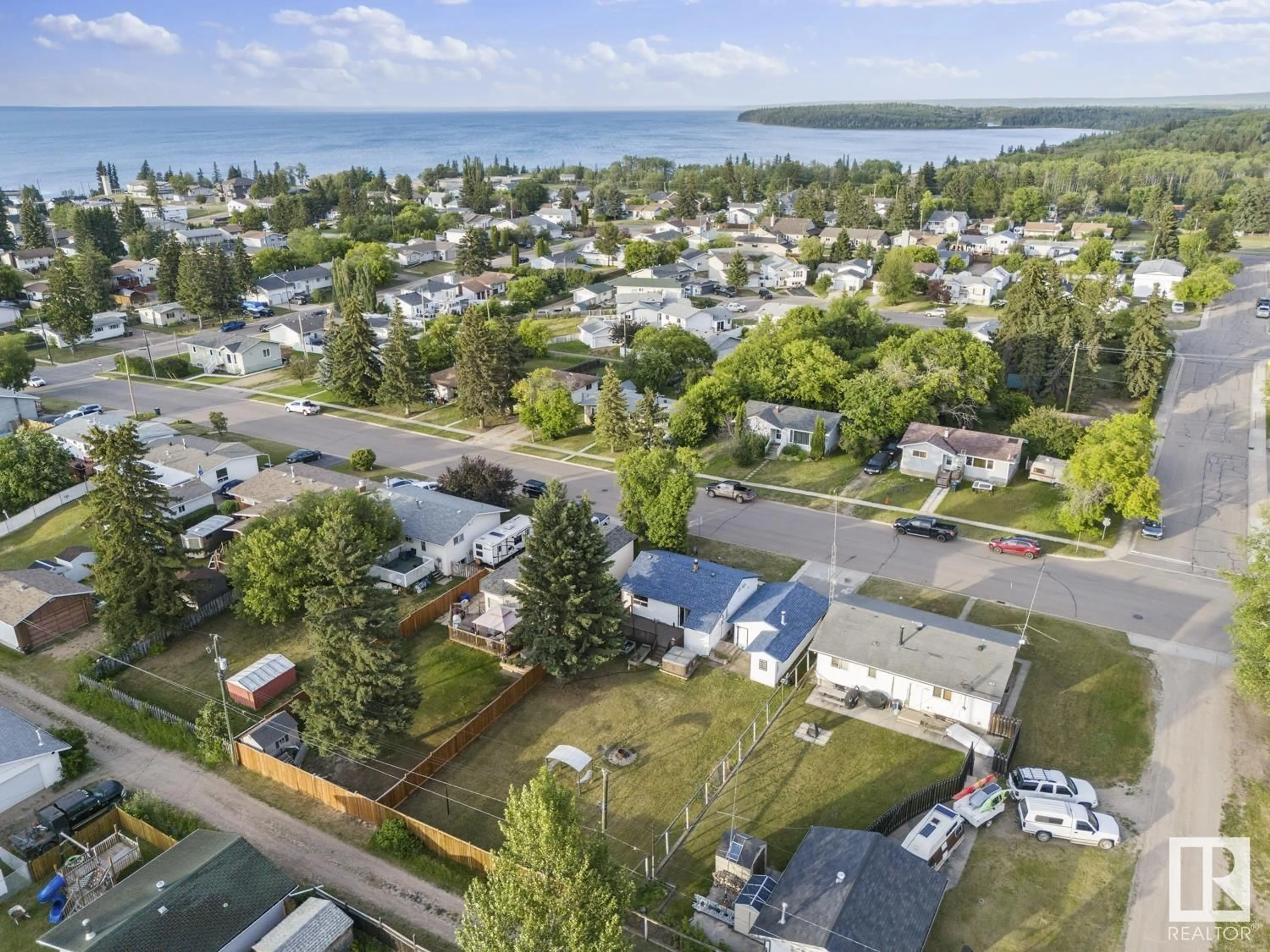A pic from outside/outdoor area/front of a property/back of a property/a pic from drone, water/lake/river/ocean view for 1213 10 ST, Cold Lake Alberta T9M1J6