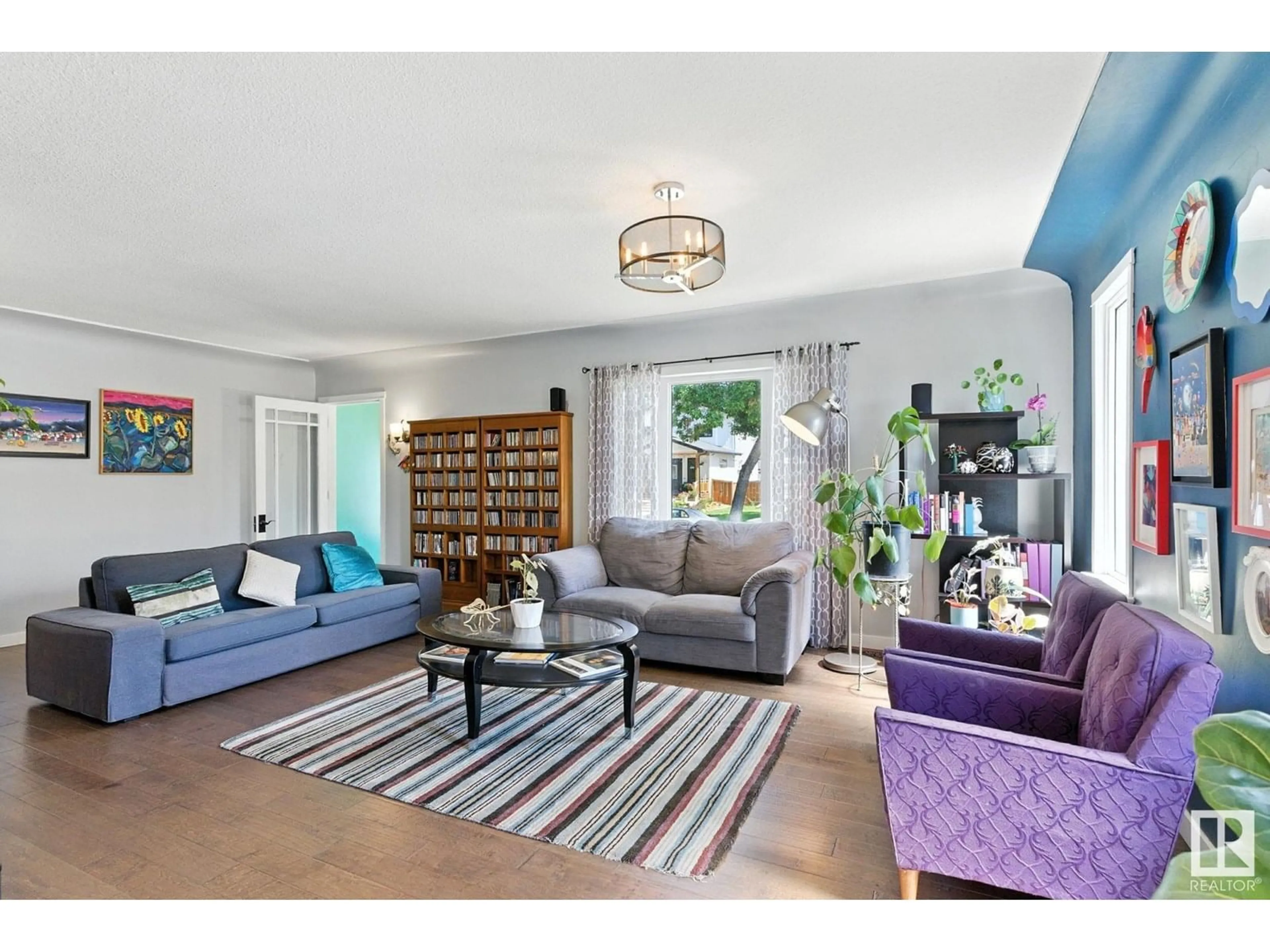 Living room with furniture, unknown for NW - 11204 61 ST, Edmonton Alberta T5W4A5