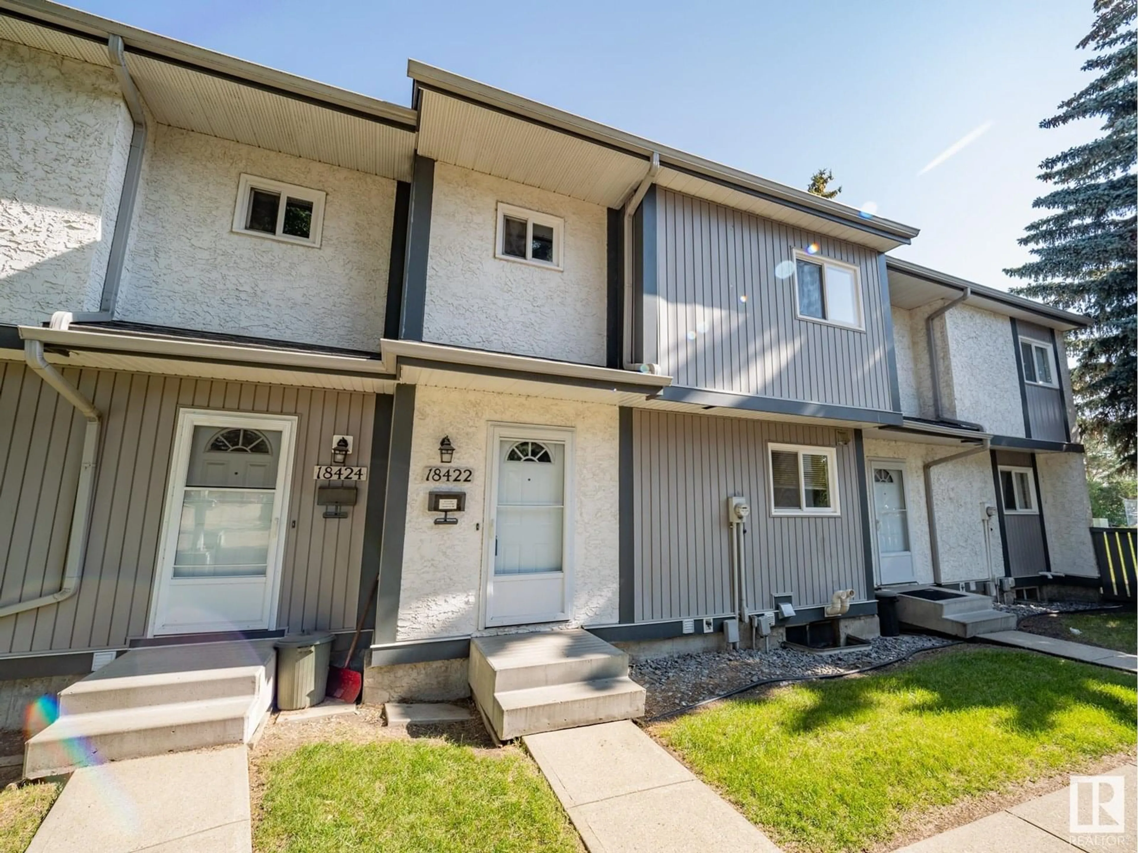Home with vinyl exterior material, street for NW - 18422 62B AV, Edmonton Alberta T5T2N7