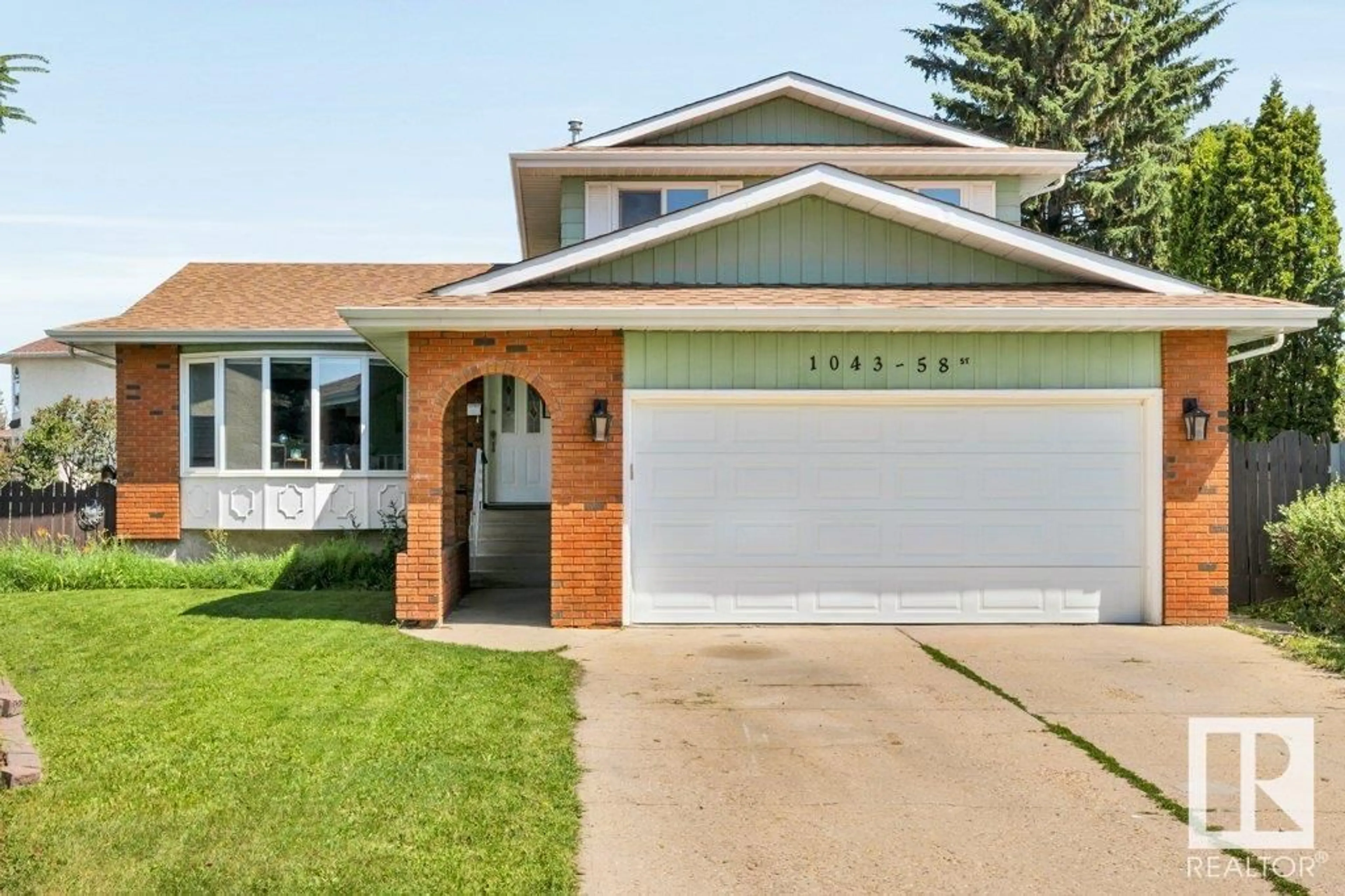 Home with vinyl exterior material, street for NW - 1043 58 ST, Edmonton Alberta T6L3W1