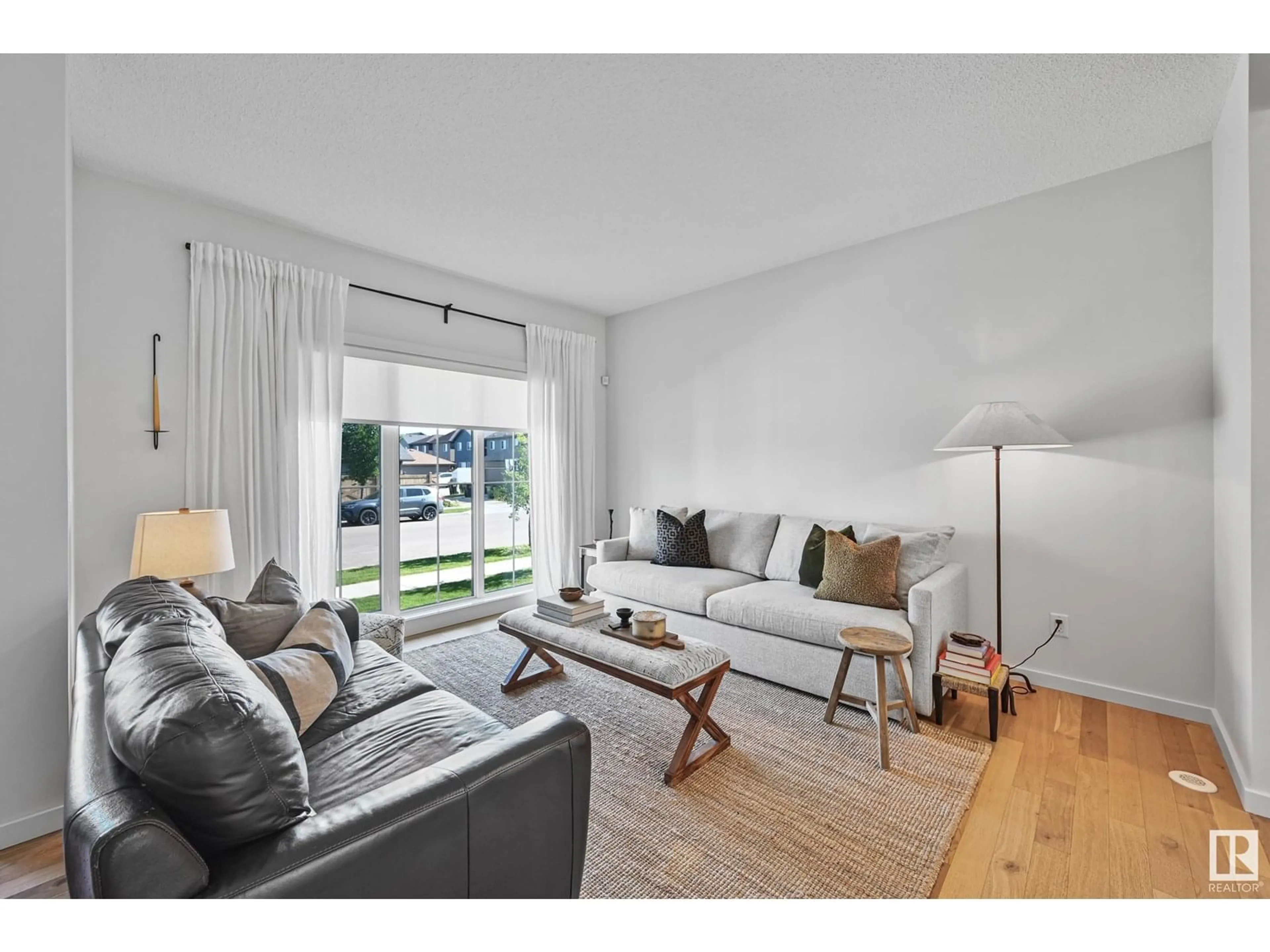 Living room with furniture, wood/laminate floor for LI SW - 1708 GRAYDON HILL LINK, Edmonton Alberta T6W4C6
