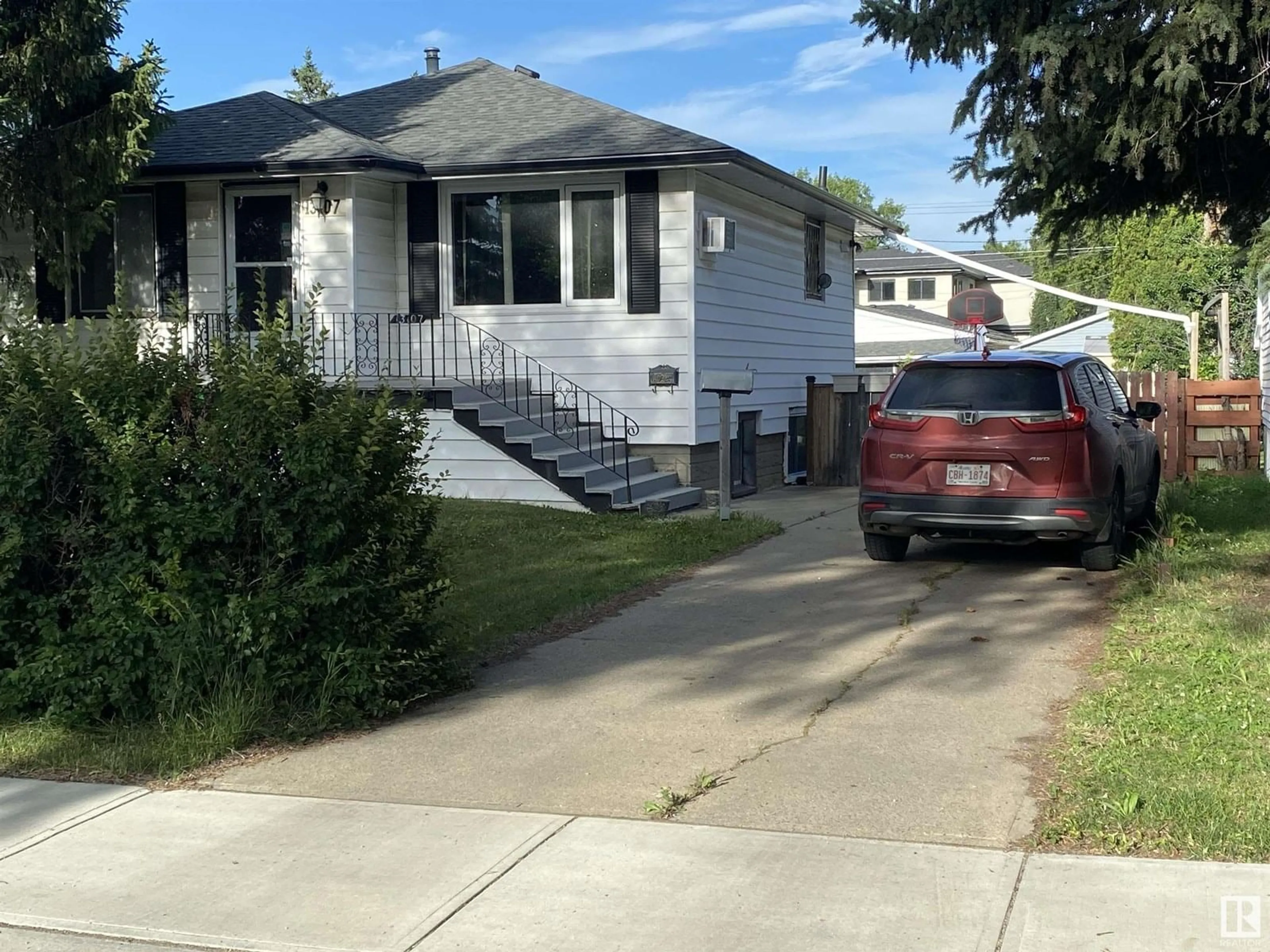Home with vinyl exterior material, street for NW - 13107 120 ST, Edmonton Alberta T5E5P1