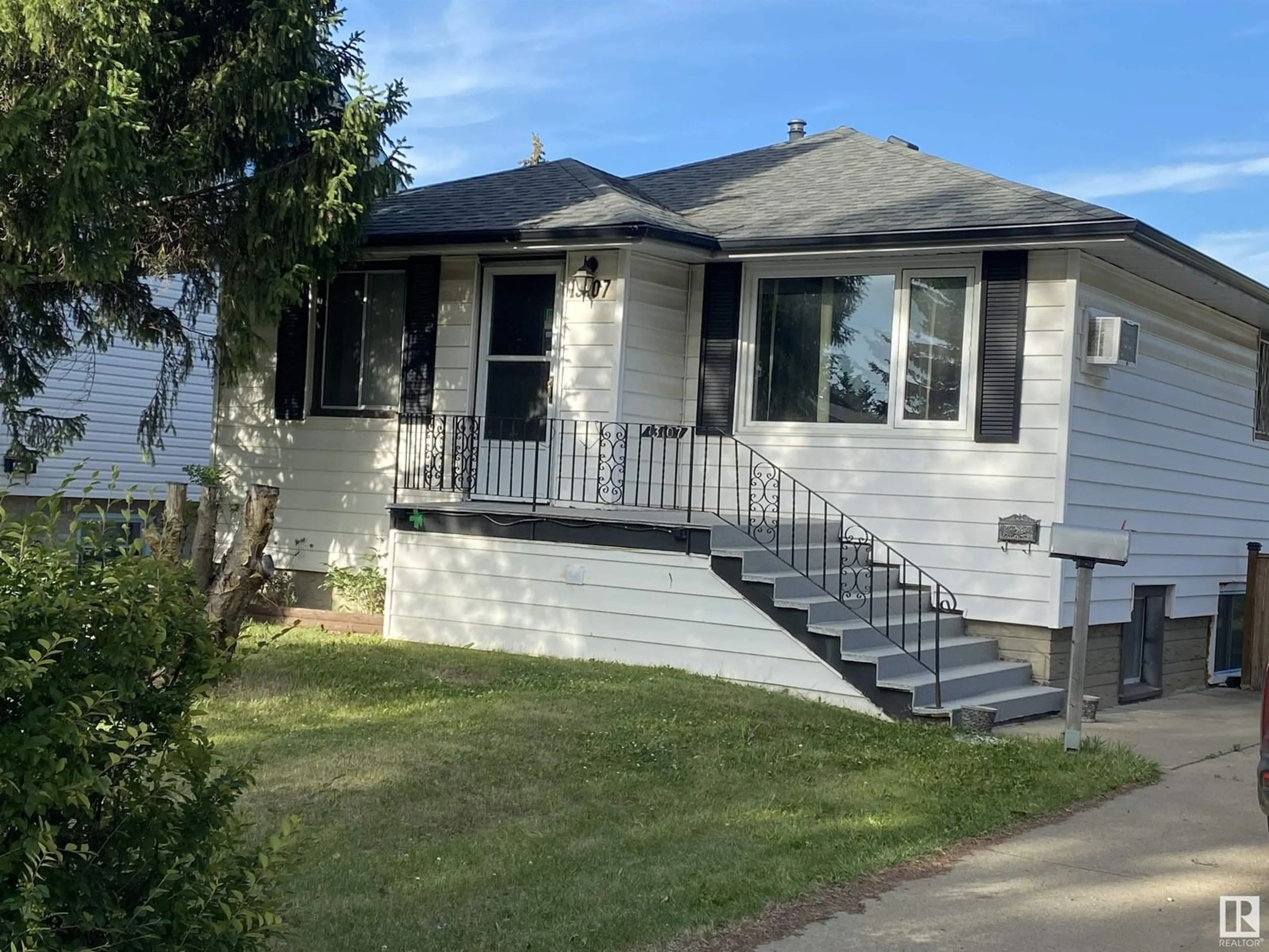 Home with vinyl exterior material, street for NW - 13107 120 ST, Edmonton Alberta T5E5P1