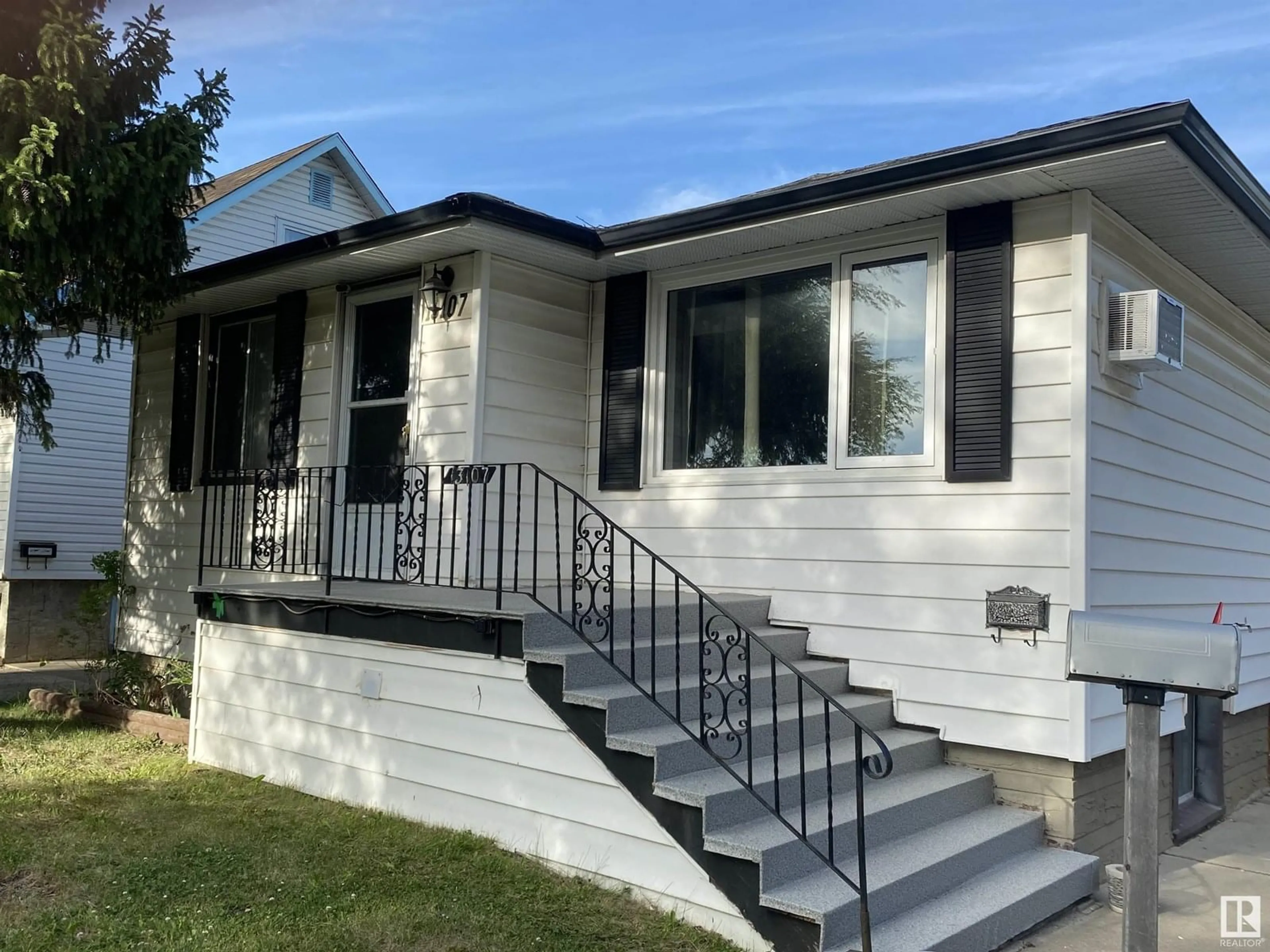 Home with vinyl exterior material, street for NW - 13107 120 ST, Edmonton Alberta T5E5P1