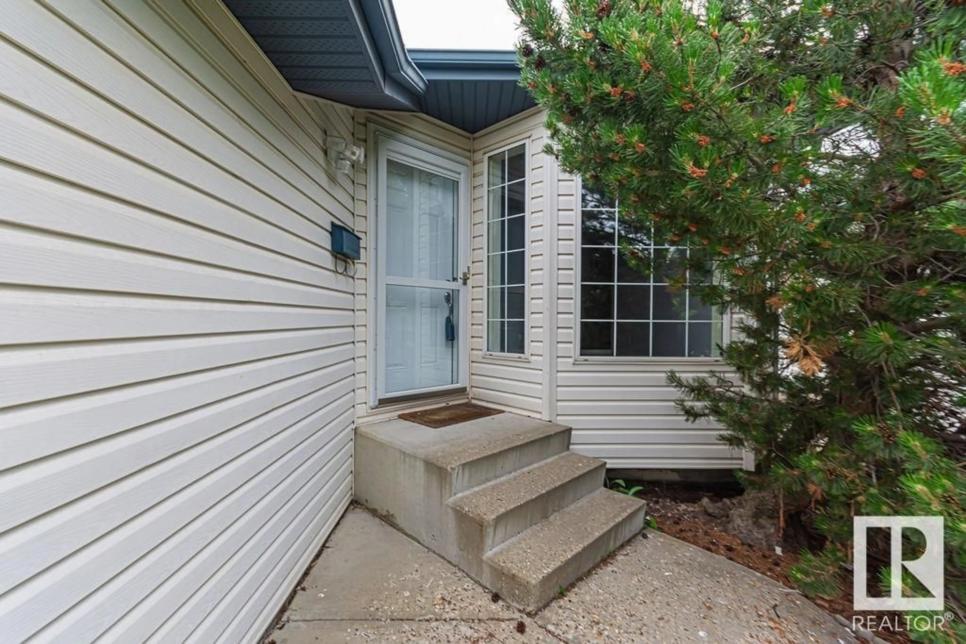 Home with vinyl exterior material, street for 13107 36 ST, Edmonton Alberta T5A5C7