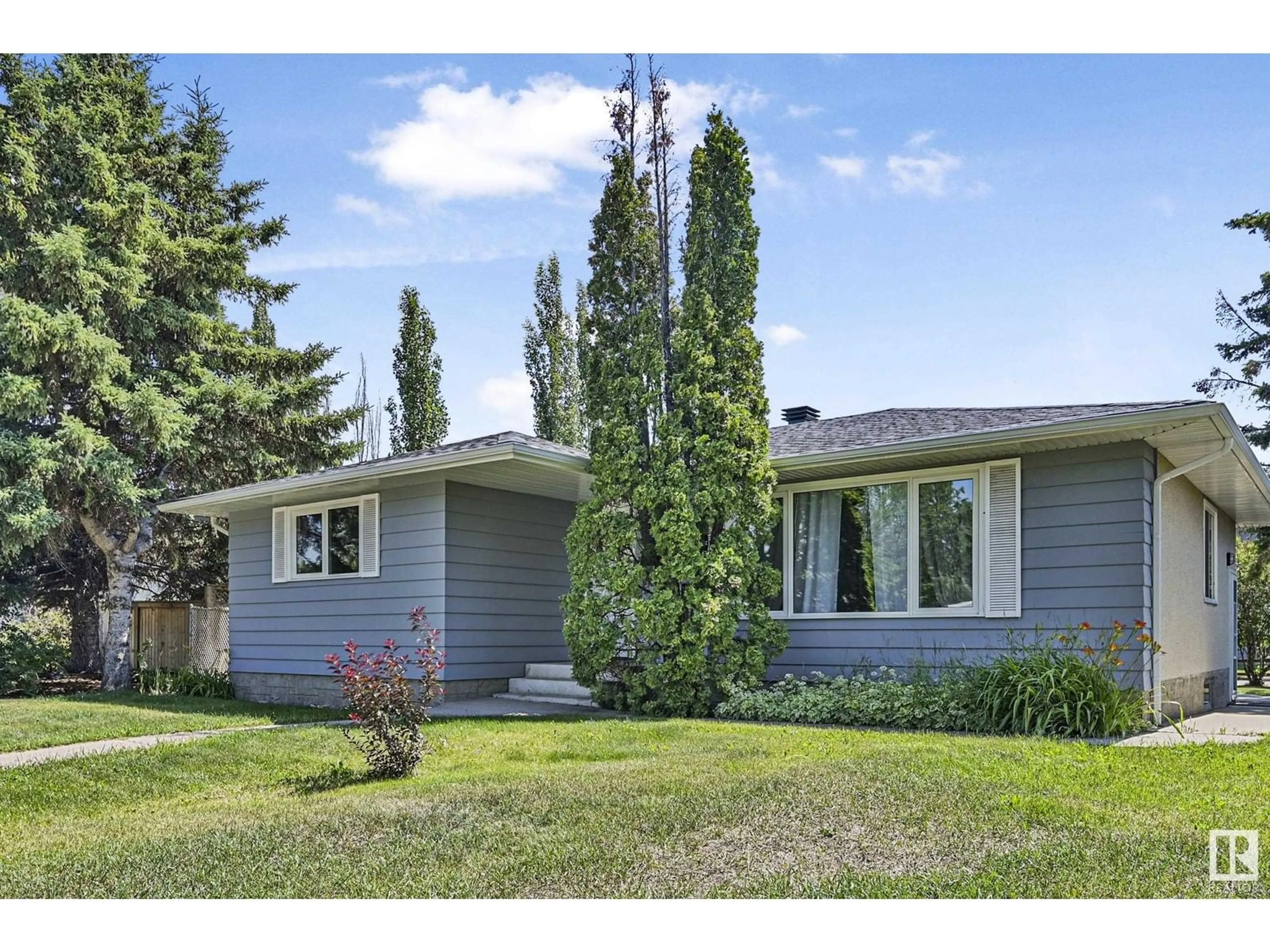 Home with vinyl exterior material, street for NW - 7111 150 AV, Edmonton Alberta T5C2X5