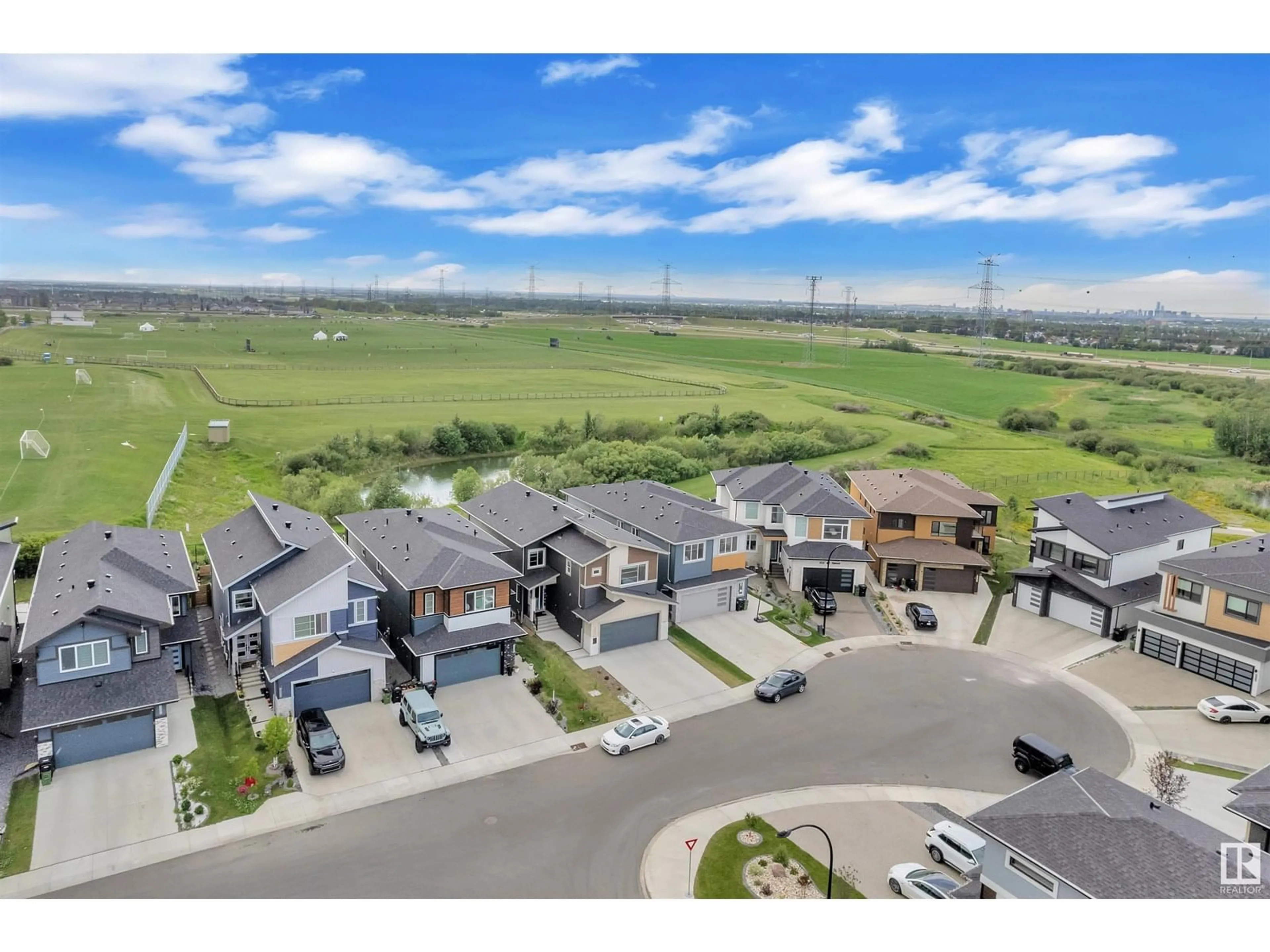 A pic from outside/outdoor area/front of a property/back of a property/a pic from drone, mountain view for SW - 220 42 ST, Edmonton Alberta T6X3A2