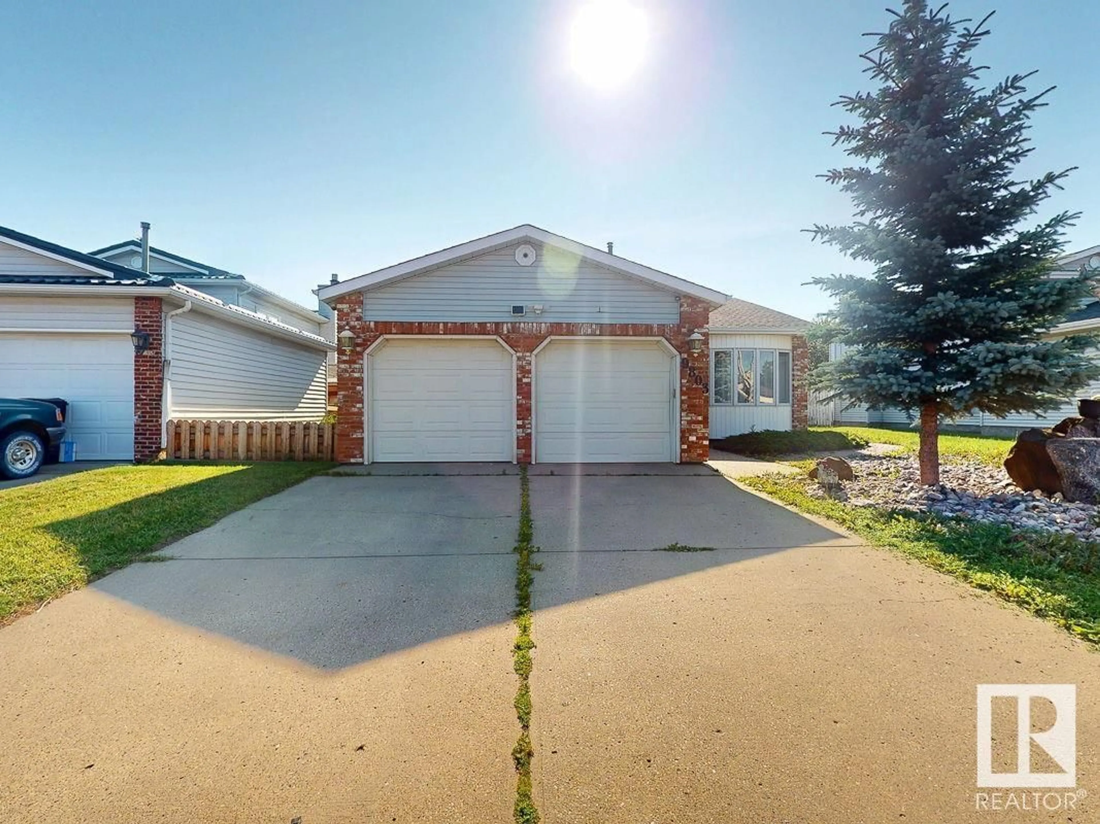 Home with vinyl exterior material, street for 9803 185 NW, Edmonton Alberta T5T3L7