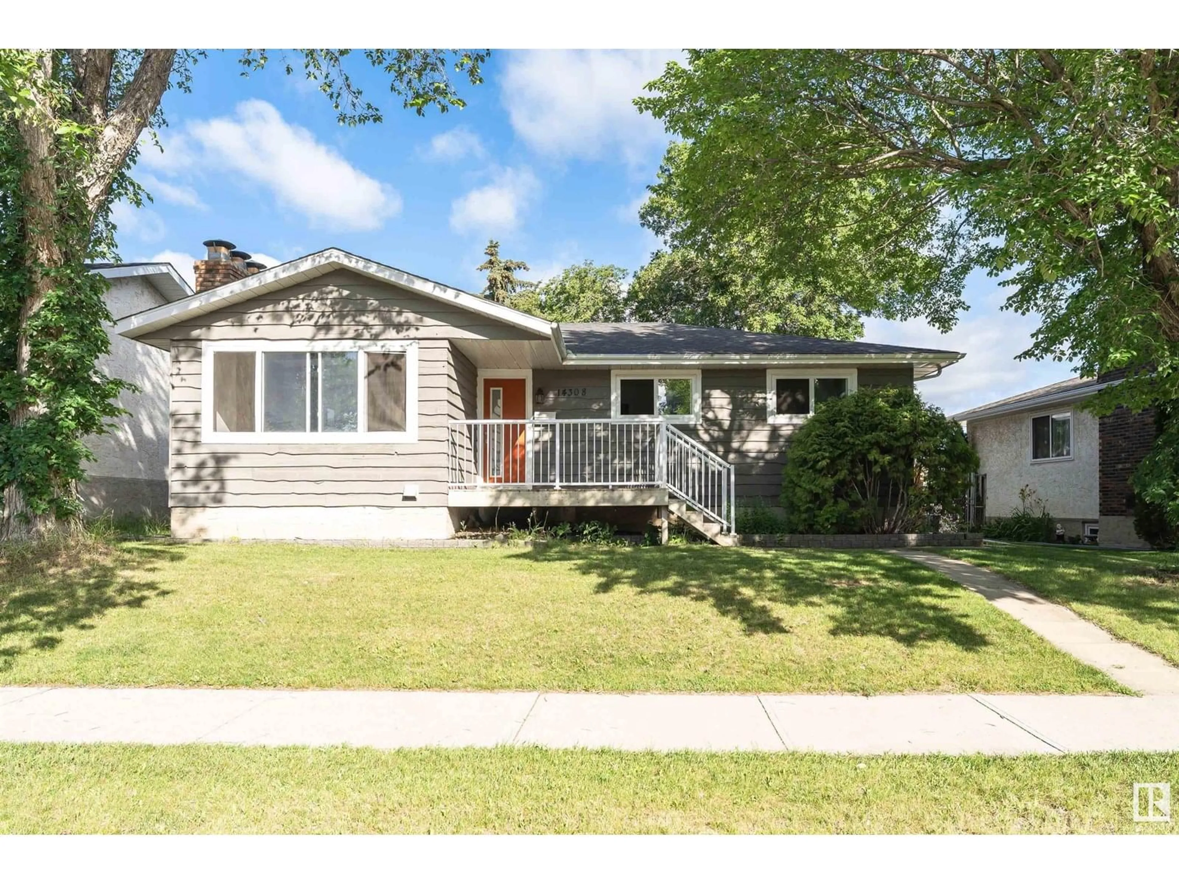 Home with vinyl exterior material, street for 14308 121 ST, Edmonton Alberta T5X3S4