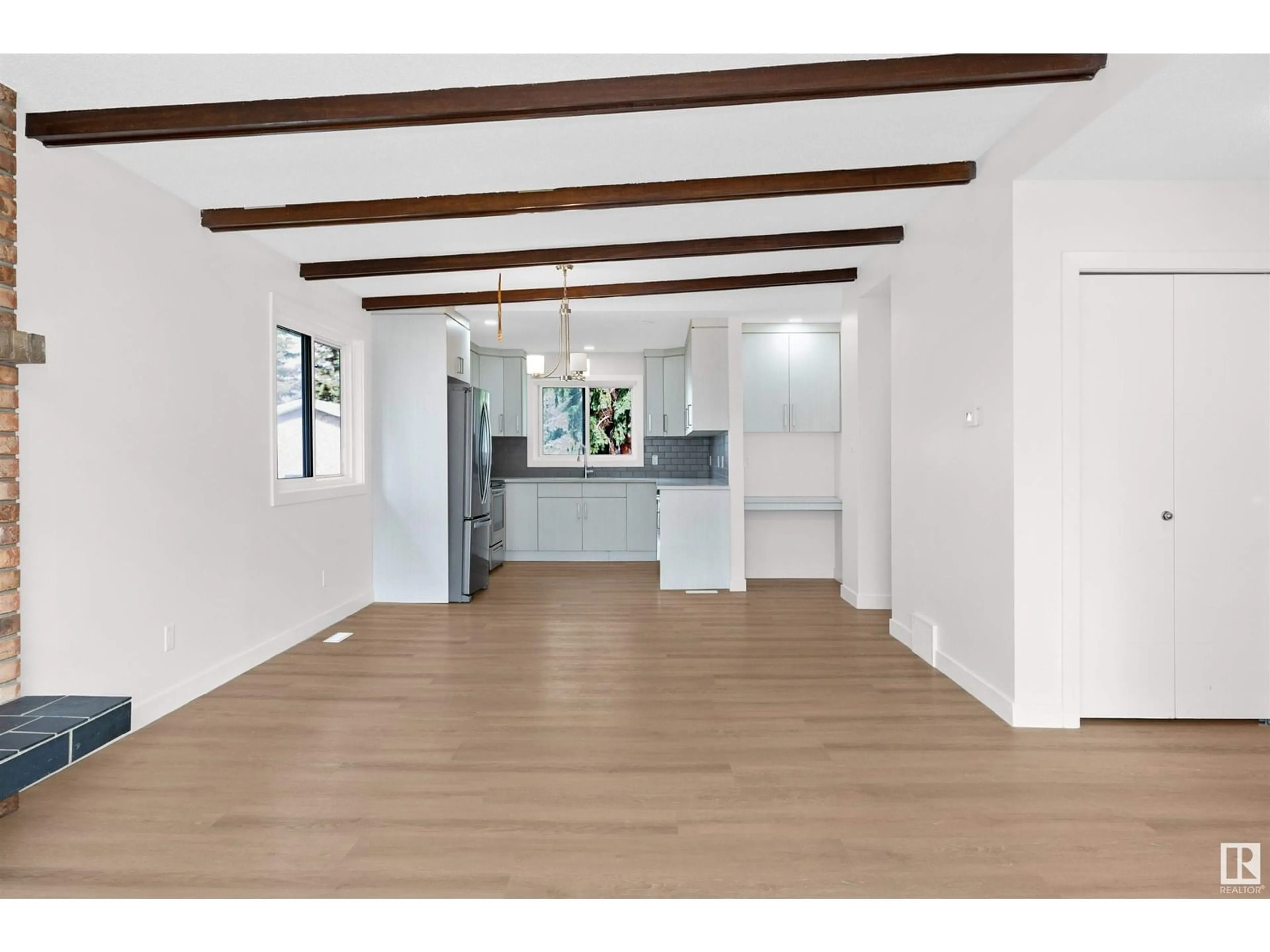 Open concept kitchen, wood/laminate floor for 14308 121 ST, Edmonton Alberta T5X3S4