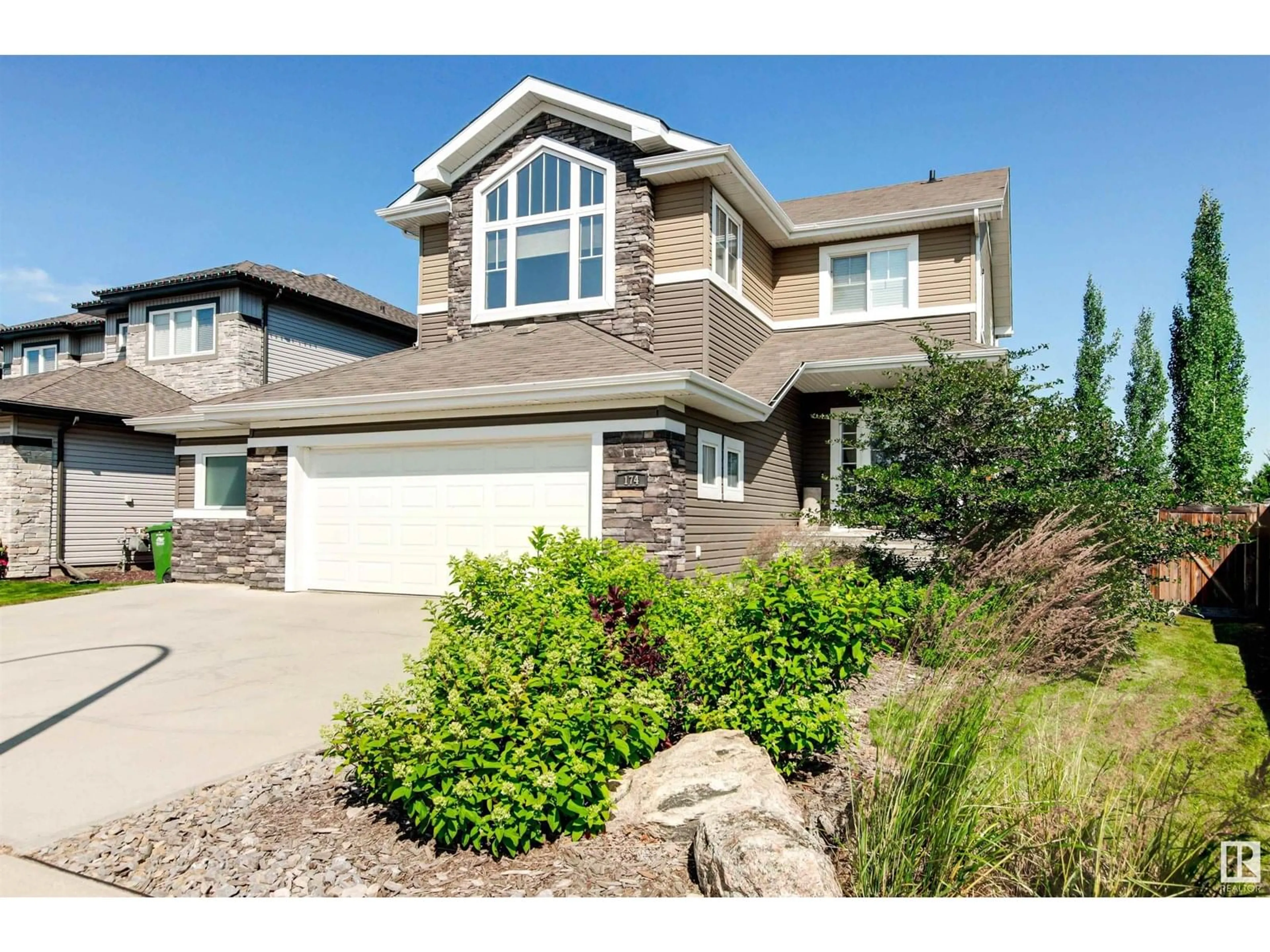 Home with vinyl exterior material, street for 174 NORTH RIDGE DR, St. Albert Alberta T8N4C1
