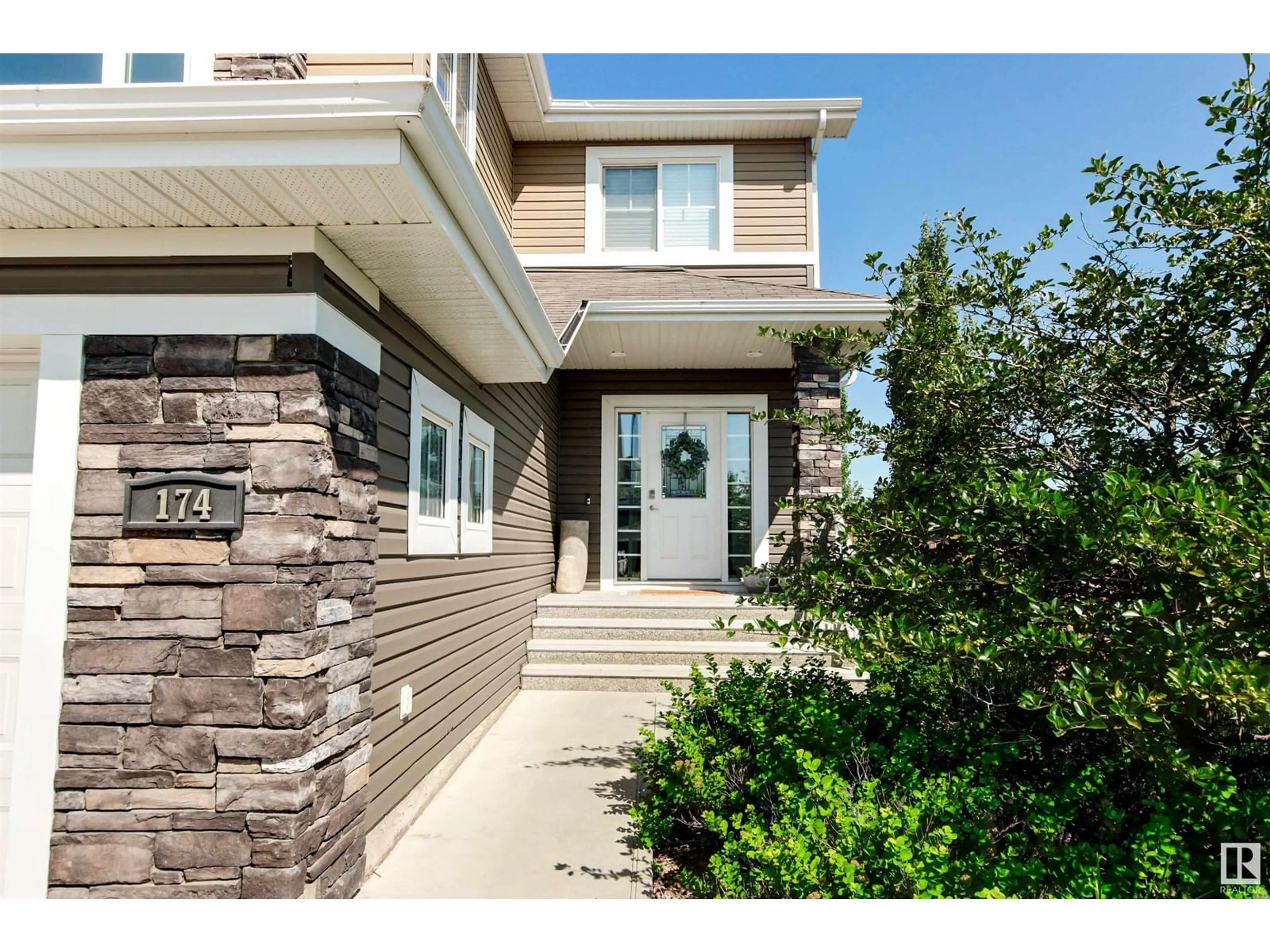 Home with vinyl exterior material, street for 174 NORTH RIDGE DR, St. Albert Alberta T8N4C1