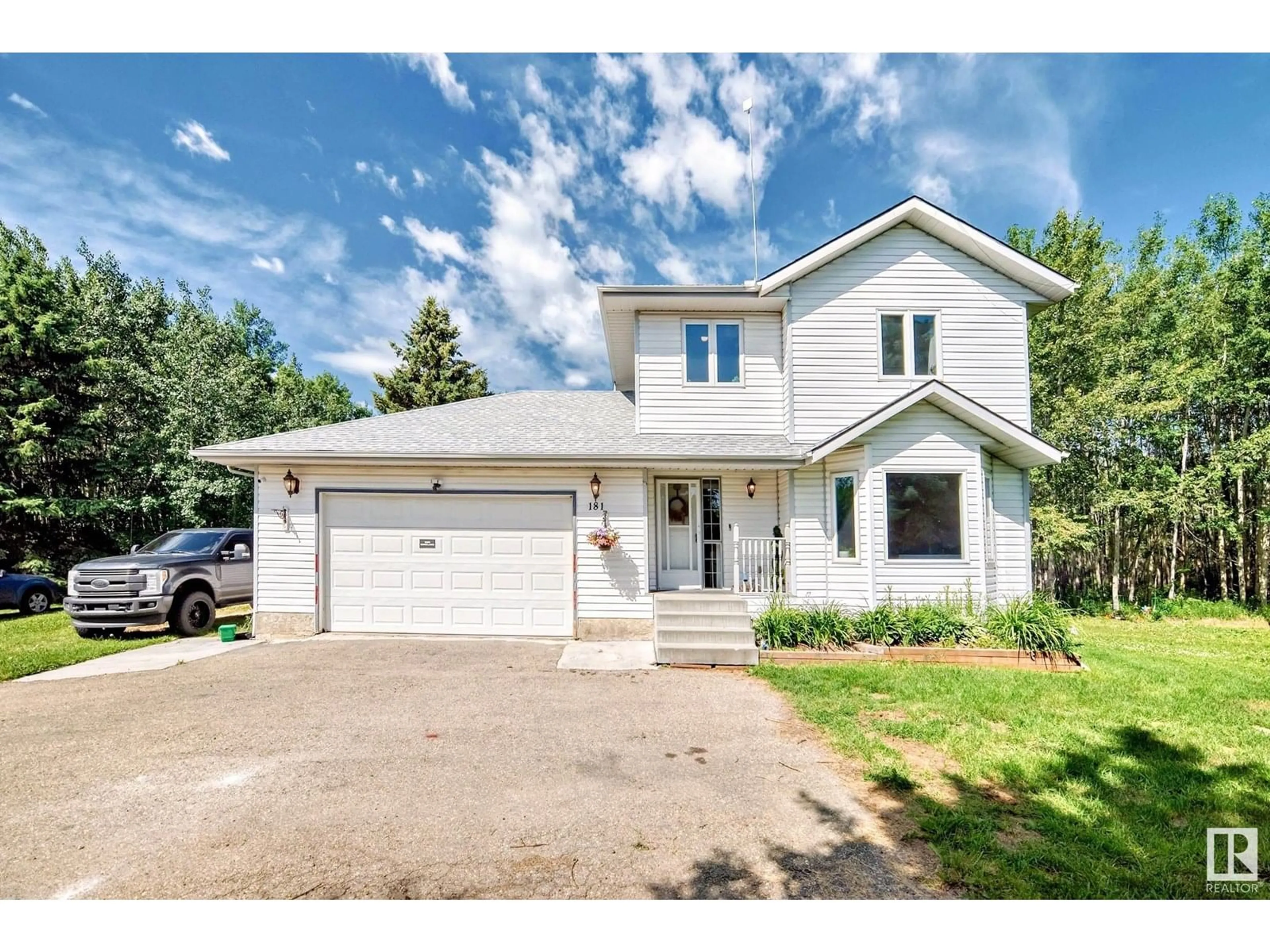 Home with vinyl exterior material, street for 52306 - 181 RGE ROAD 212 RGE ROAD, Rural Strathcona County Alberta T8G1A9