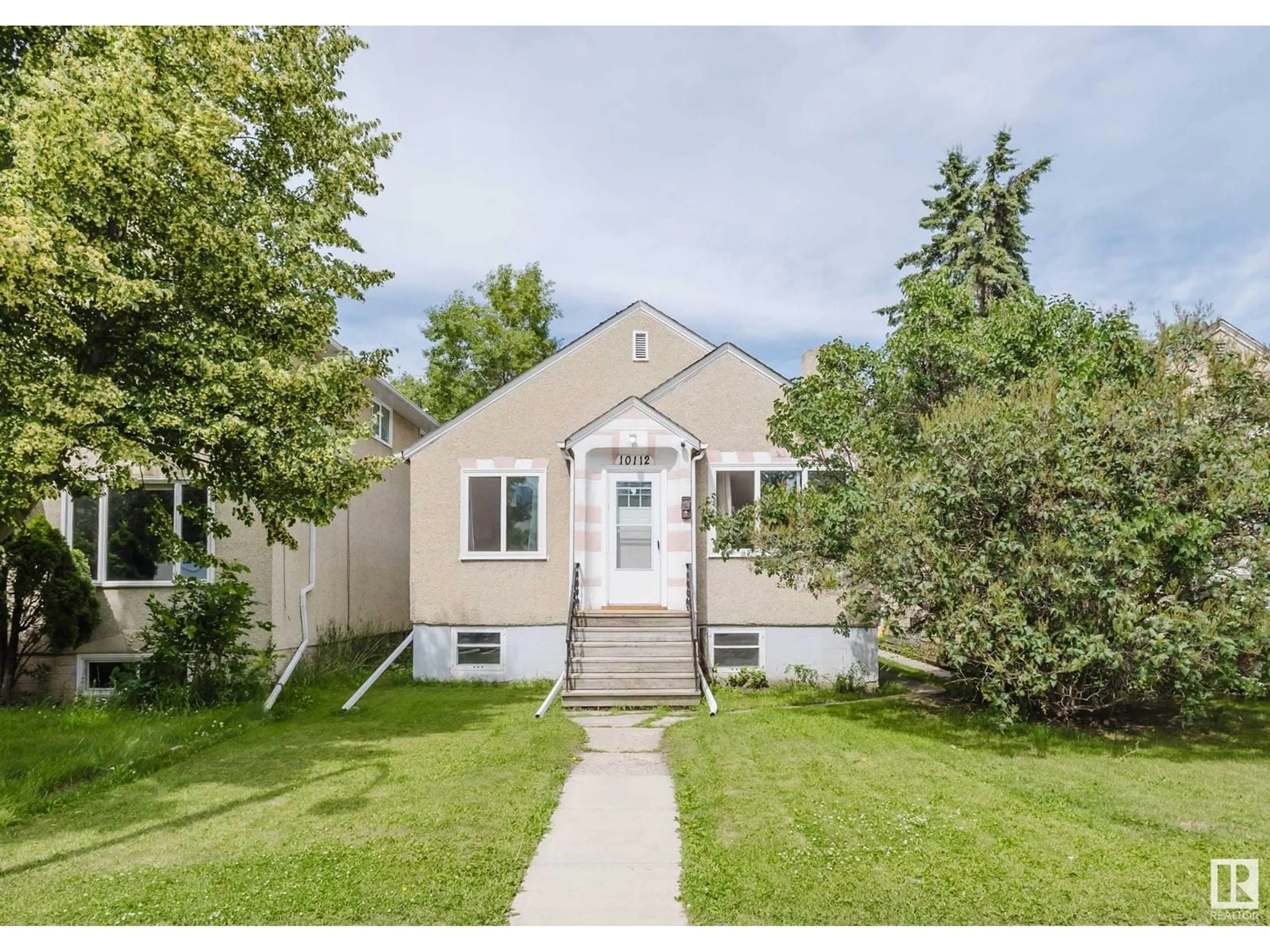 Home with vinyl exterior material, street for 10112 86 AV, Edmonton Alberta T6E2M1