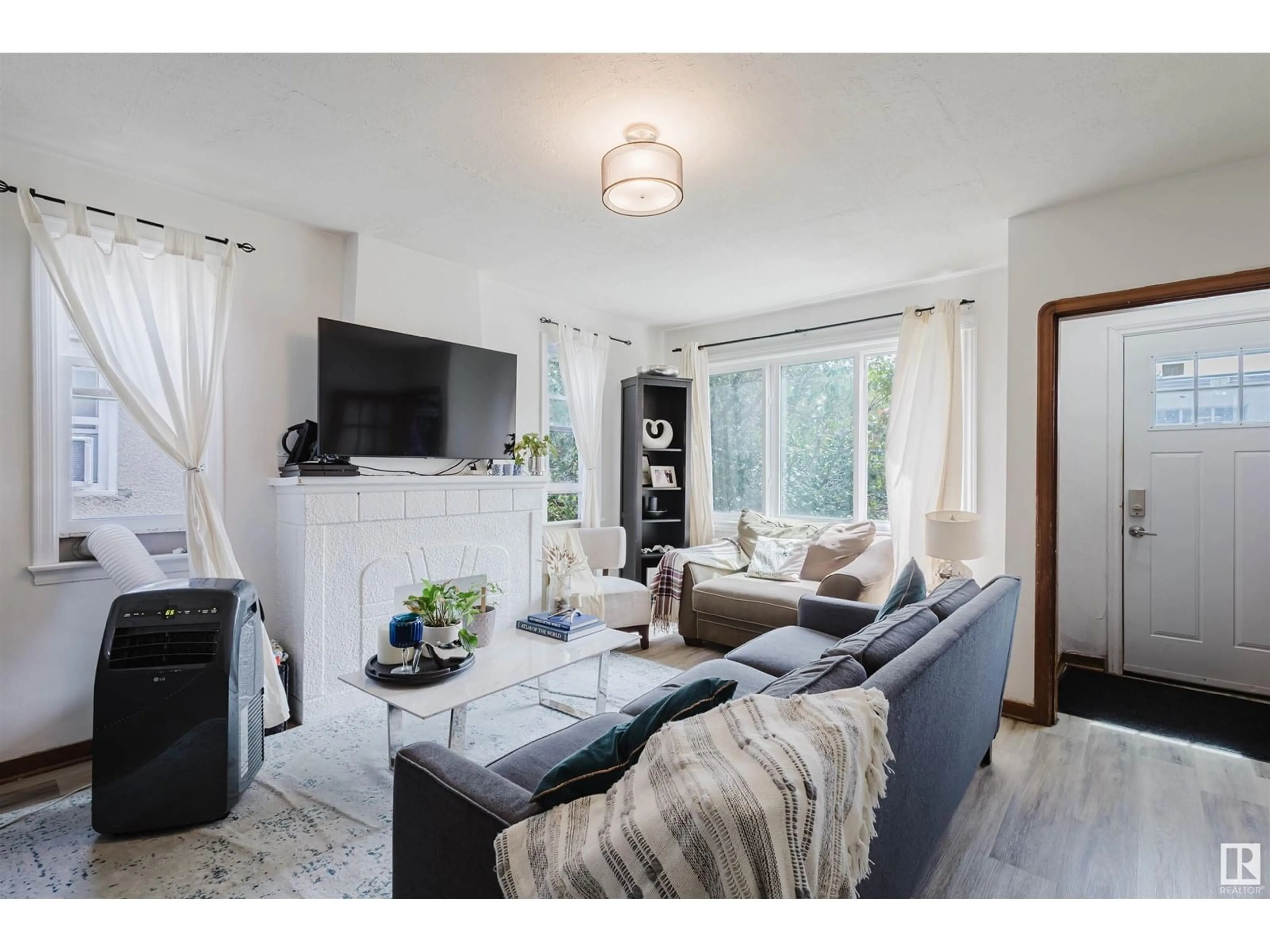 Living room with furniture, unknown for 10112 86 AV, Edmonton Alberta T6E2M1