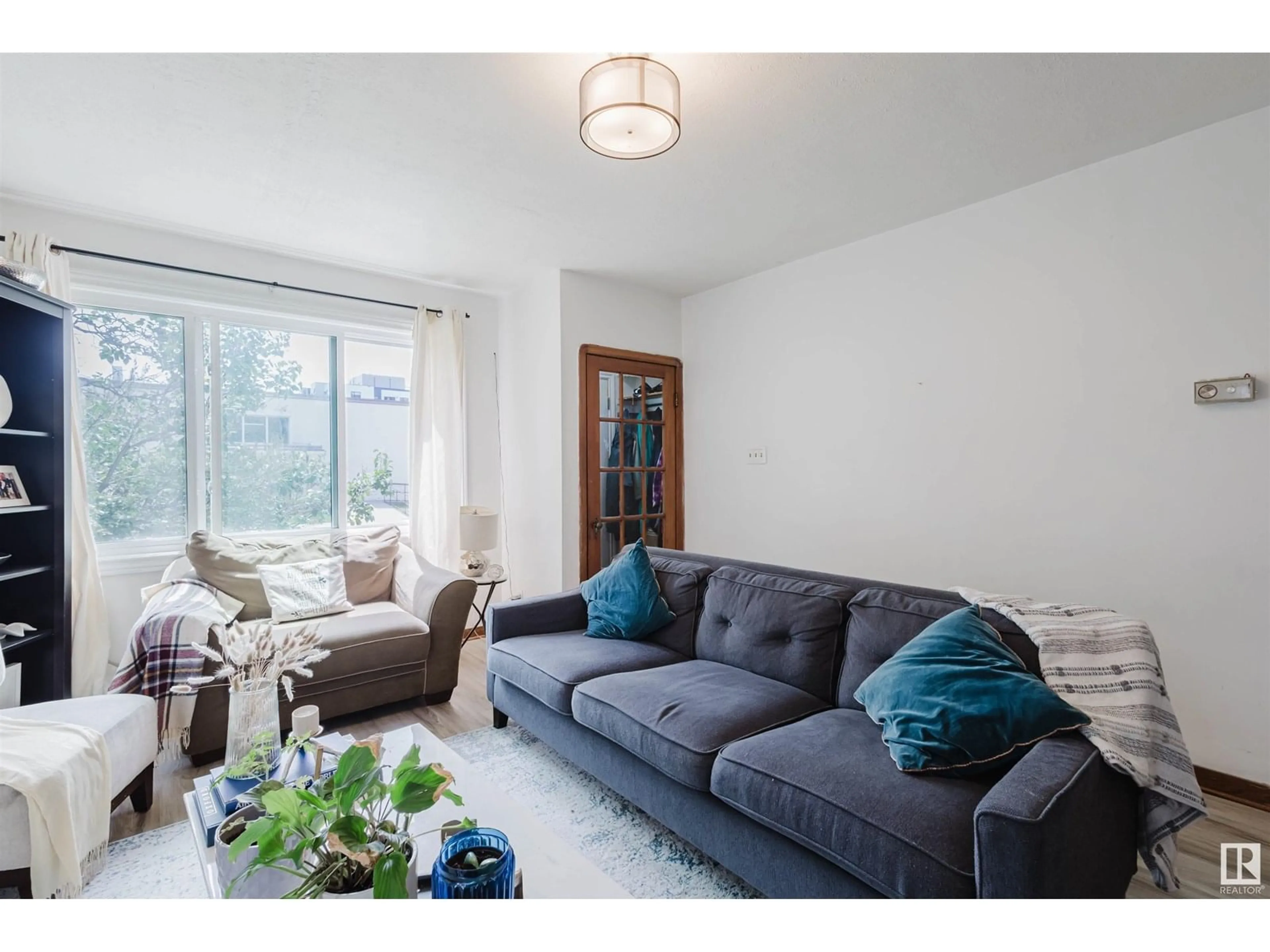 Living room with furniture, unknown for 10112 86 AV, Edmonton Alberta T6E2M1