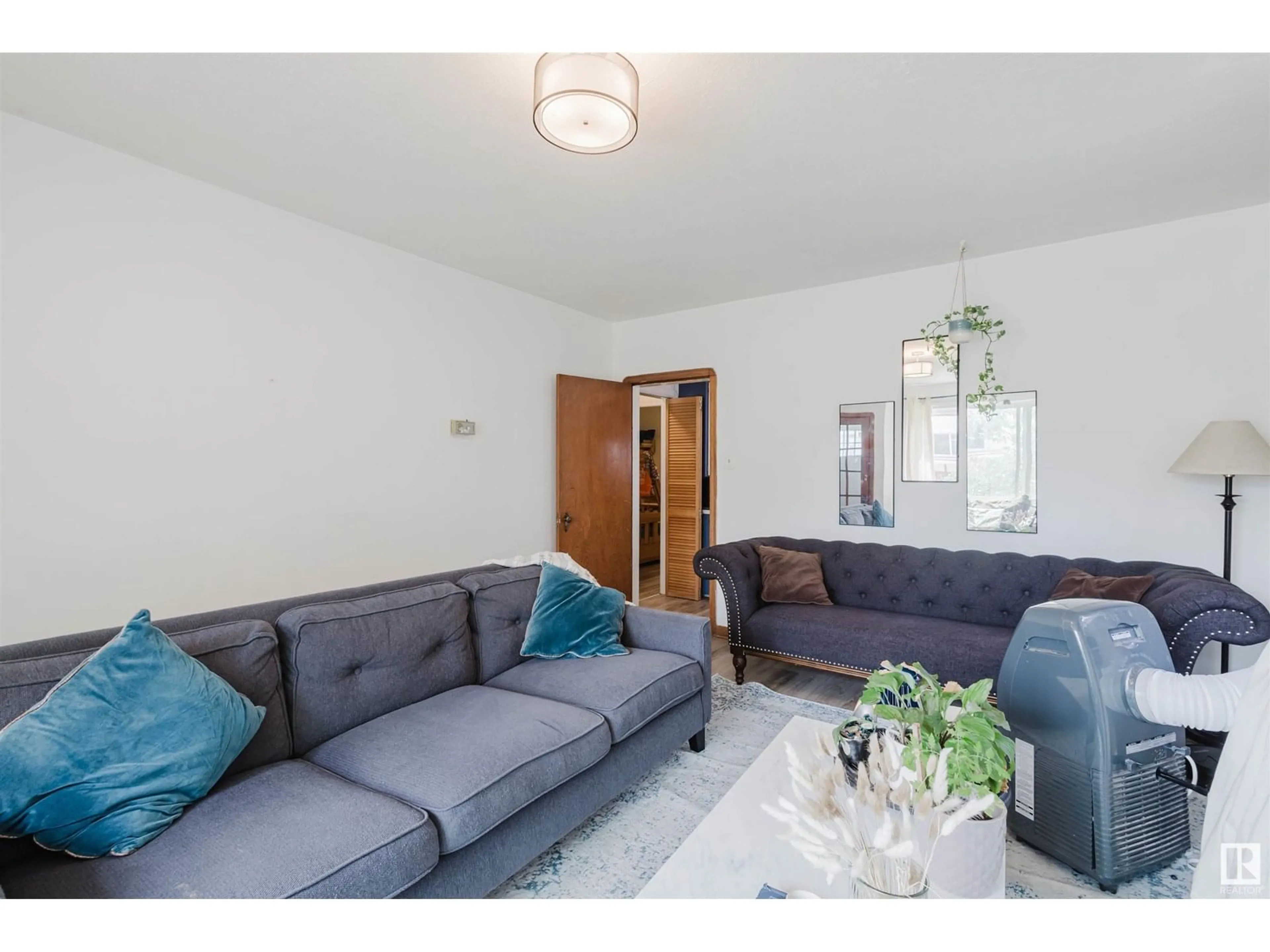 Living room with furniture, unknown for 10112 86 AV, Edmonton Alberta T6E2M1