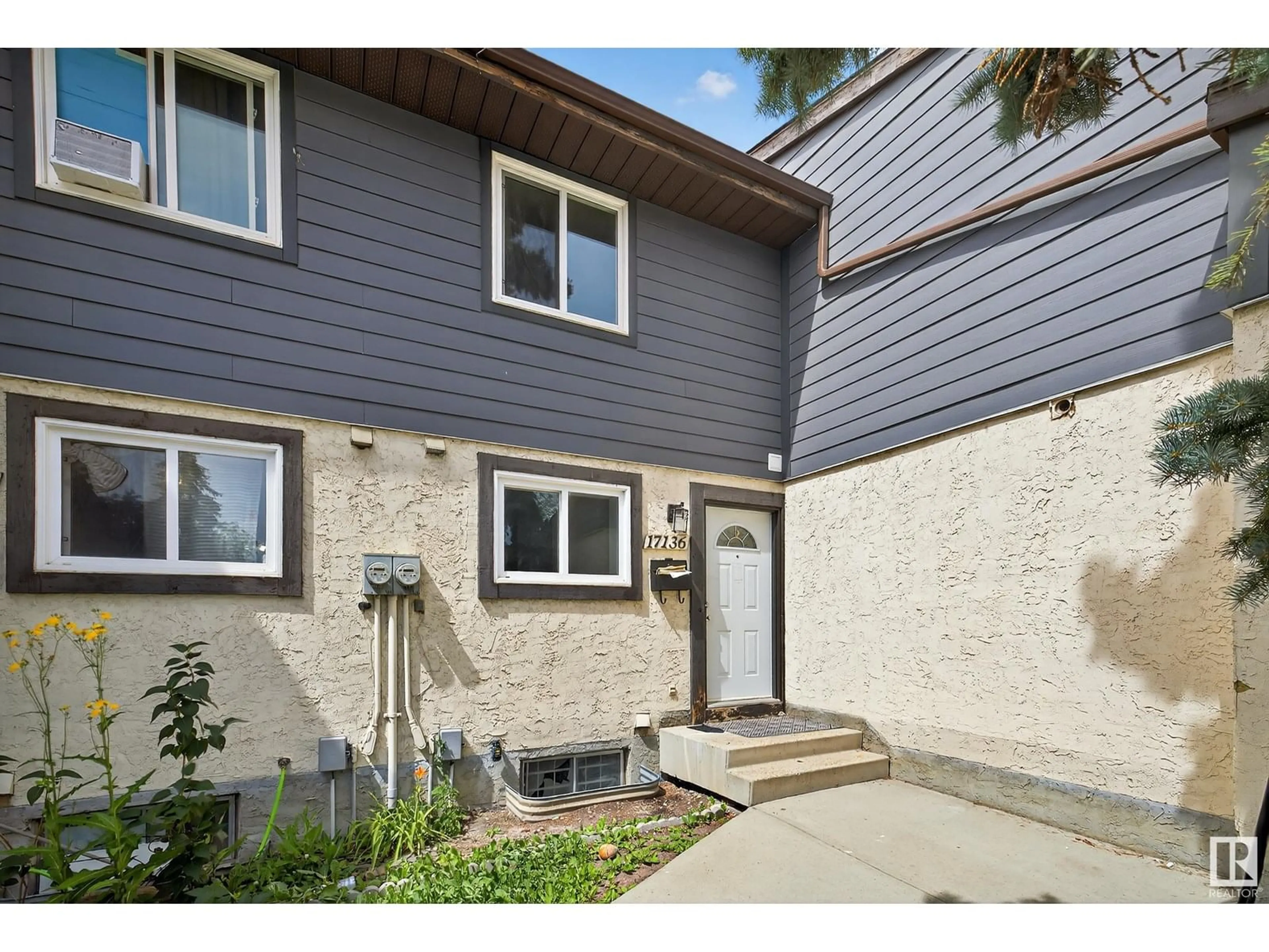 Home with vinyl exterior material, street for 17136 100 ST, Edmonton Alberta T5X5H3